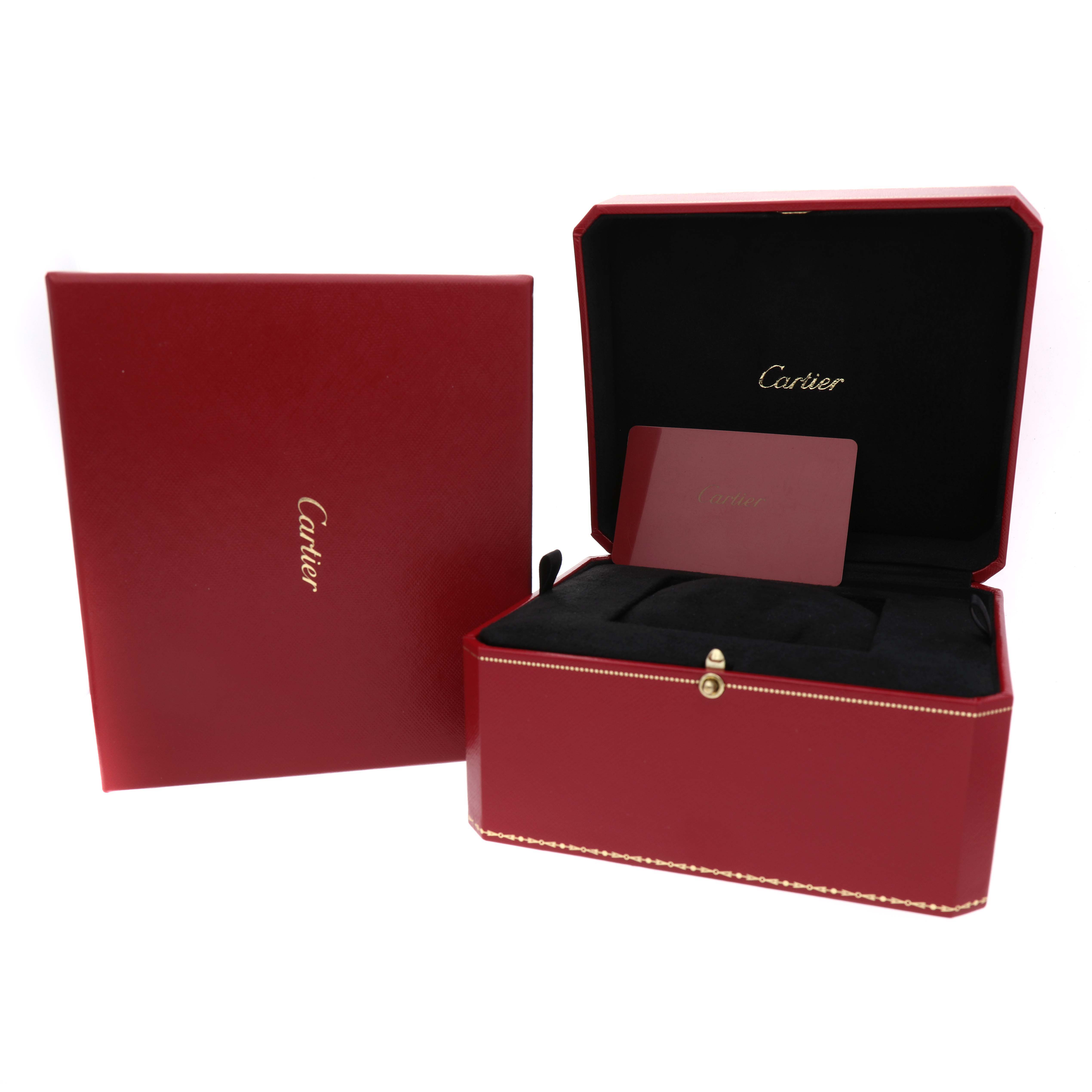 The image shows a Cartier Calibre de Cartier WSCA0010 Men's Stainless Steel Blue Dial watch box and card from a front angle.