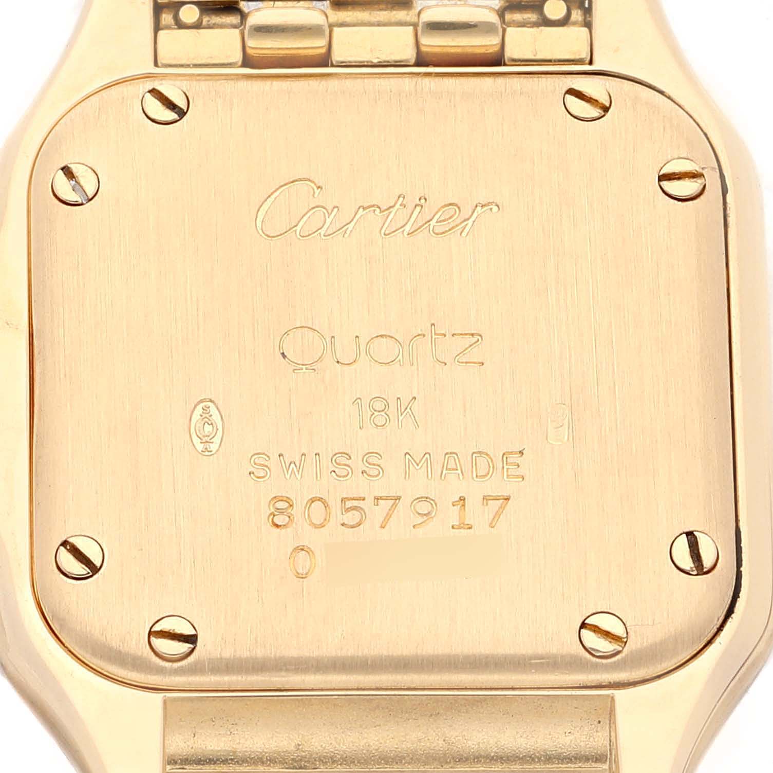 The image shows the back case of a Cartier Panthere W25022B9 Women's Yellow Gold Silver Dial W25022B9 Women's Yellow Gold Silver Dial watch, showcasing its engravings and screws.