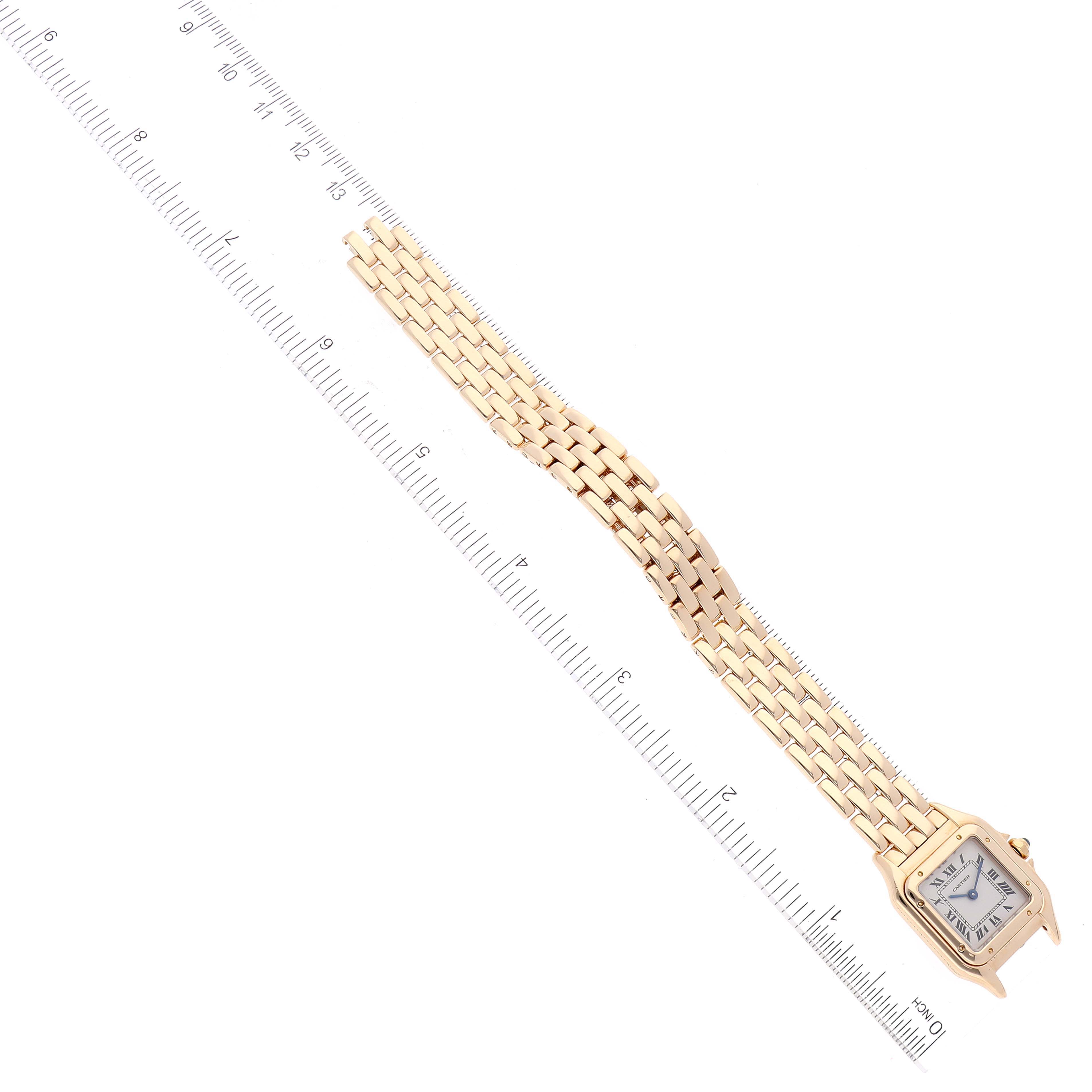 The image shows a Cartier Panthere W25022B9 Women's Yellow Gold Silver Dial W25022B9 Women's Yellow Gold Silver Dial watch laid flat alongside a ruler, showing both the face and the linked bracelet.