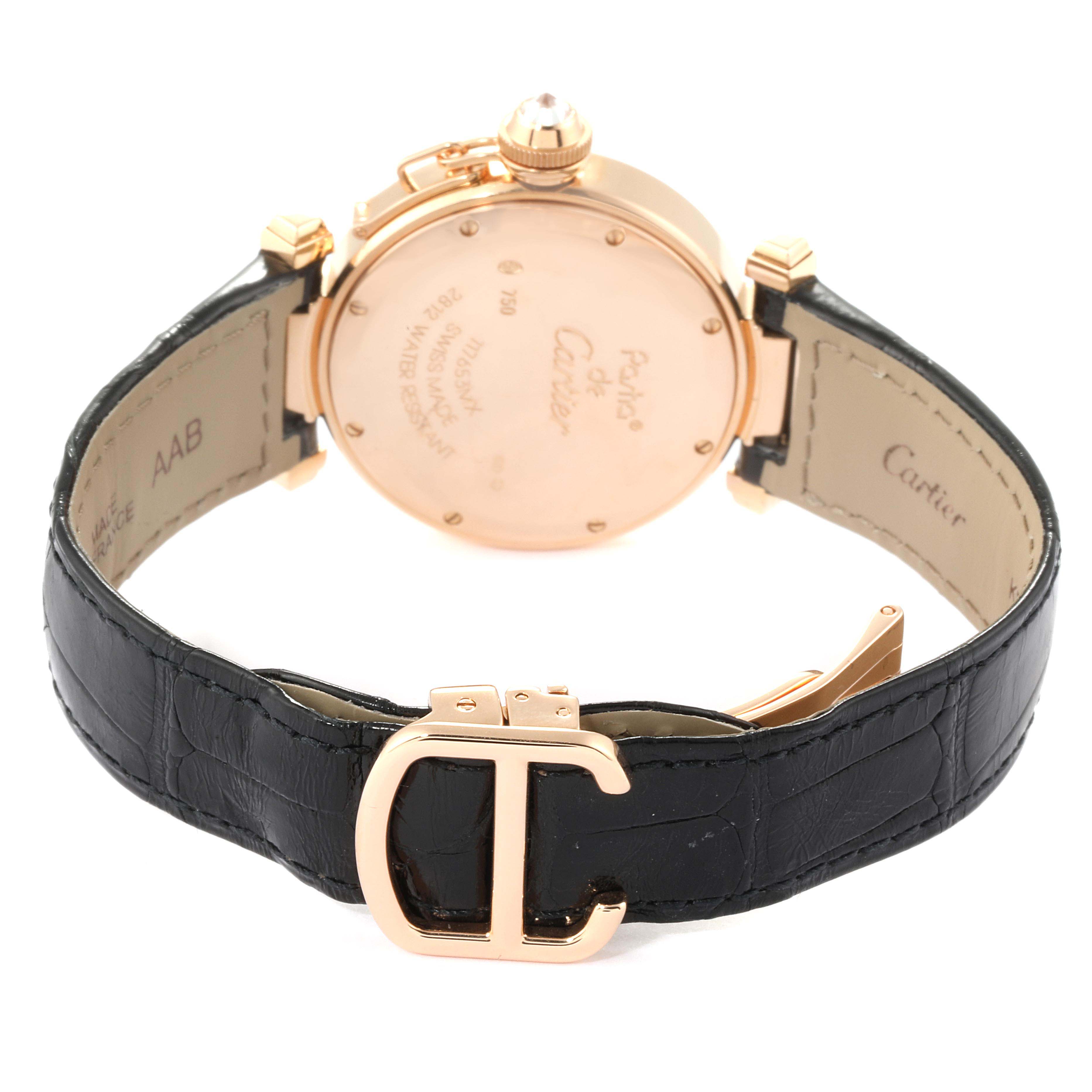 The image shows the back view of a Cartier Pasha WJ11913G Women's Rose Gold Silver Dial WJ11913G Women's Rose Gold Silver Dial watch, highlighting its case back, metal casing, black leather strap, and clasp.