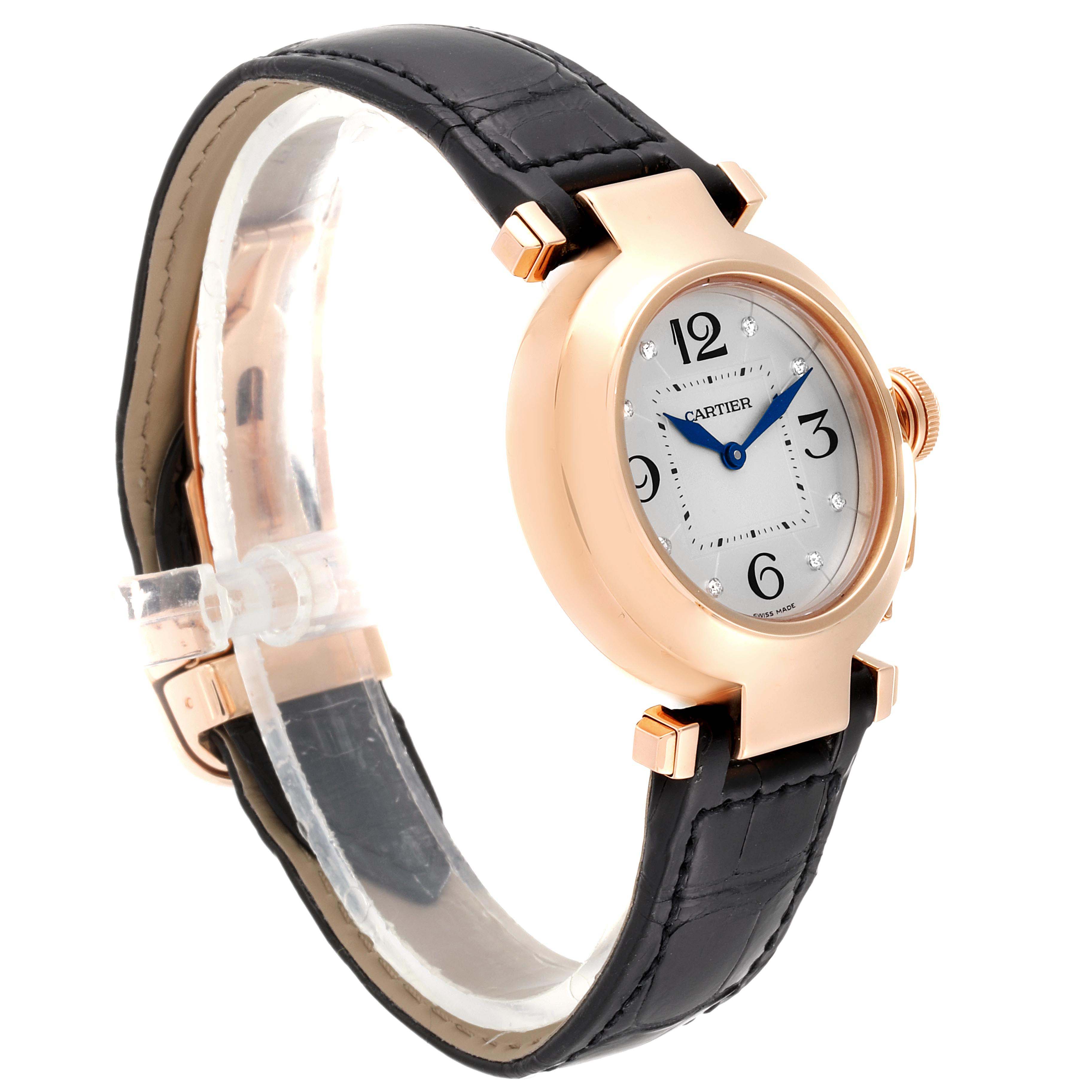 This image shows a side angle of the Cartier Pasha WJ11913G Women's Rose Gold Silver Dial WJ11913G Women's Rose Gold Silver Dial watch, highlighting its face, crown, and black leather strap.