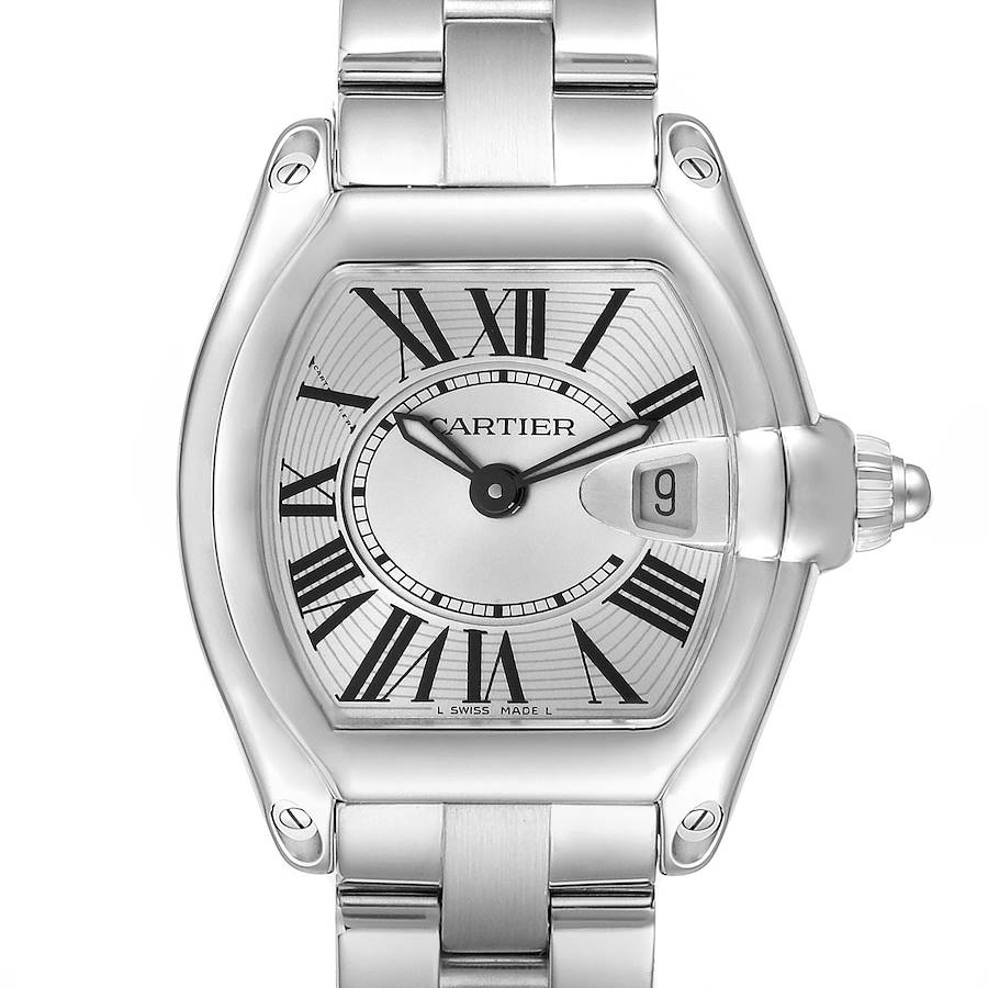 The Cartier Roadster model W62016V3 is shown from a front angle, highlighting the dial, Roman numerals, date window, and stainless steel bracelet.