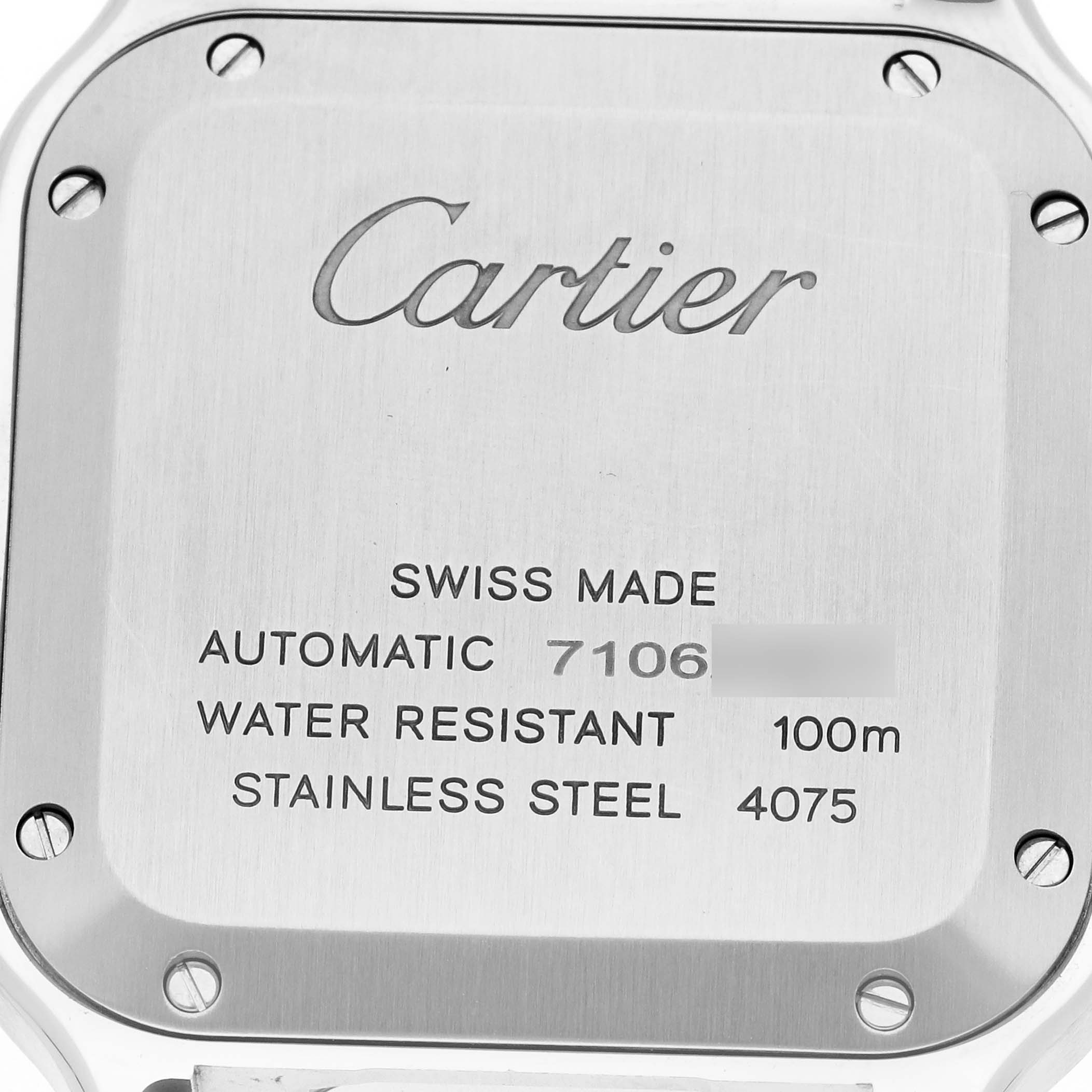 The image shows the back of a Cartier Santos WSSA0029 Men
s Stainless Steel Silver Dial watch, highlighting the inscriptions and screw details.