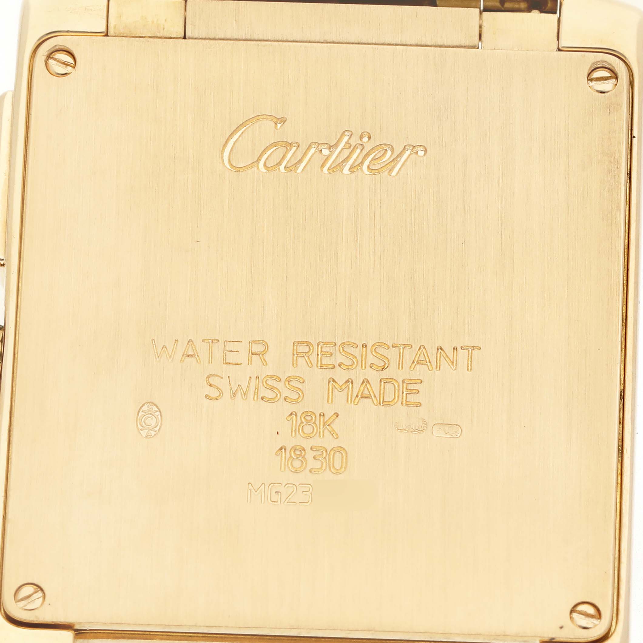 The image shows the back case of the Cartier Tank Française watch, highlighting its engravings and material details.