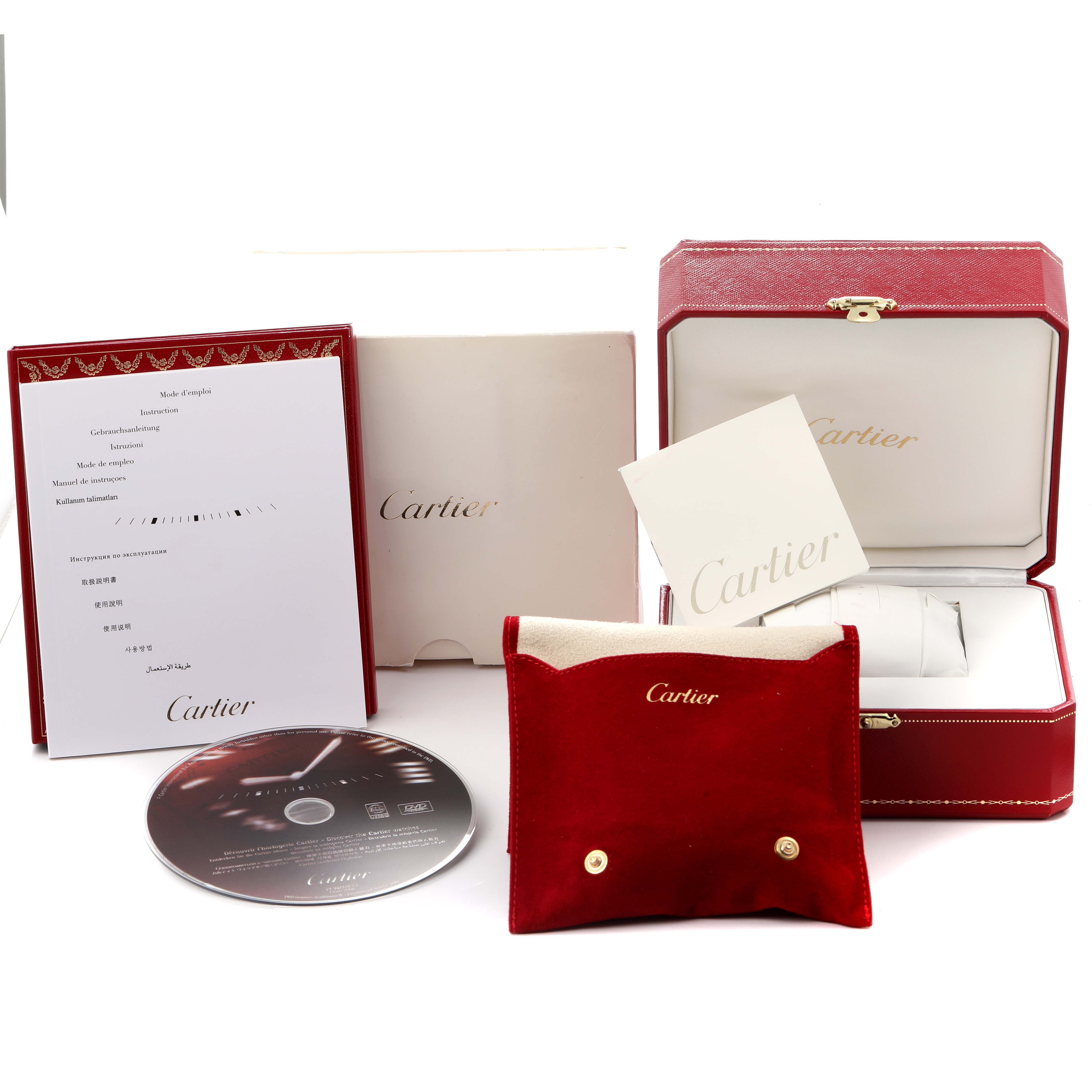 The image shows Cartier Tank Francaise W50005R2 Men
s Yellow Gold Silver Dial watch accessories, including a box, pouch, warranty booklet, and a CD, displayed from the front.