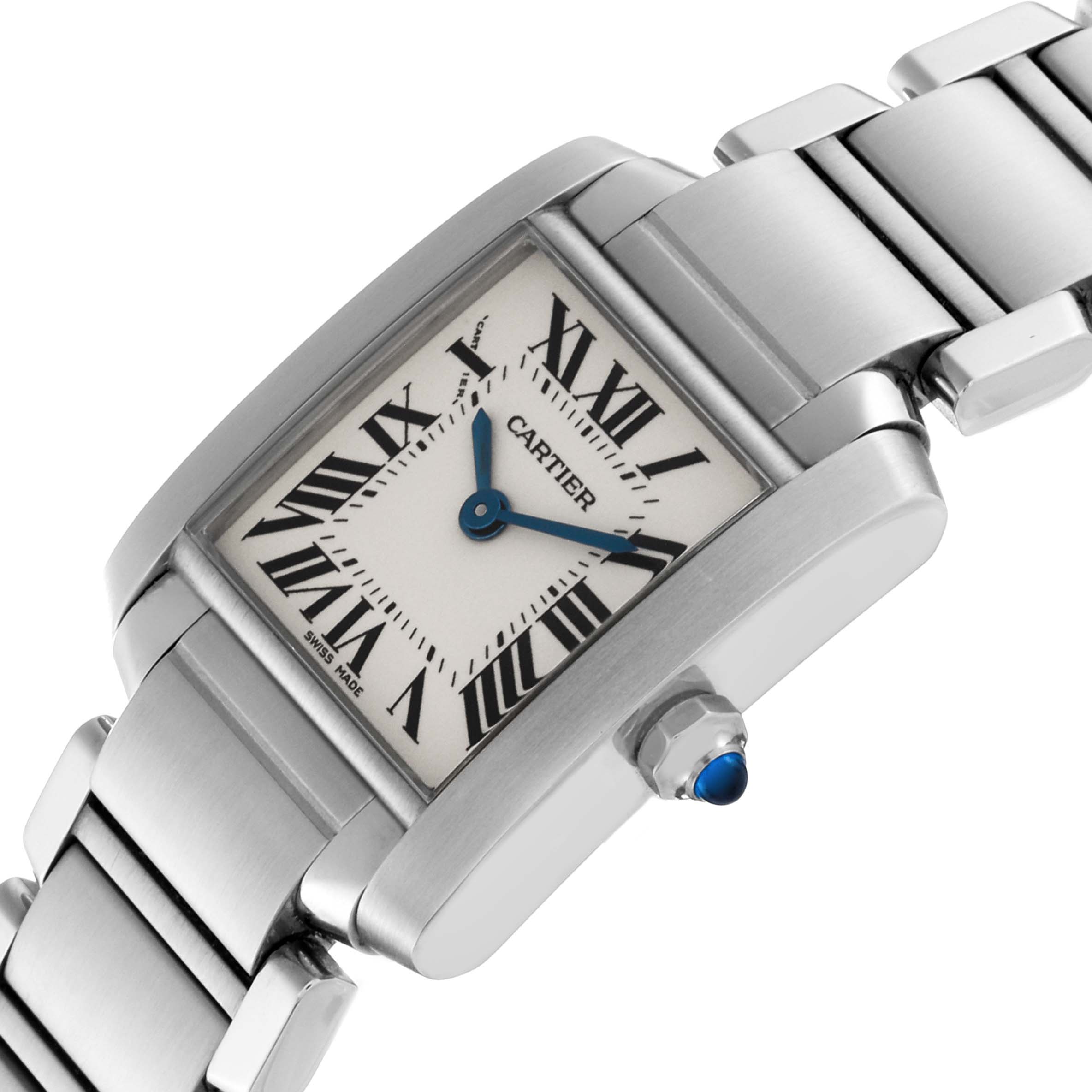 The Cartier Tank Française watch is shown at an angled side view, highlighting its rectangular face, Roman numerals, and metal link bracelet.