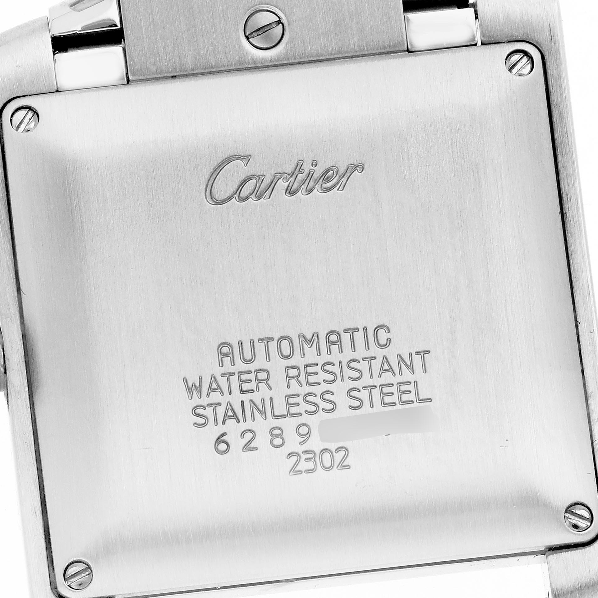 The image shows the back of a Cartier Tank Française watch featuring engraved text on a stainless steel surface.