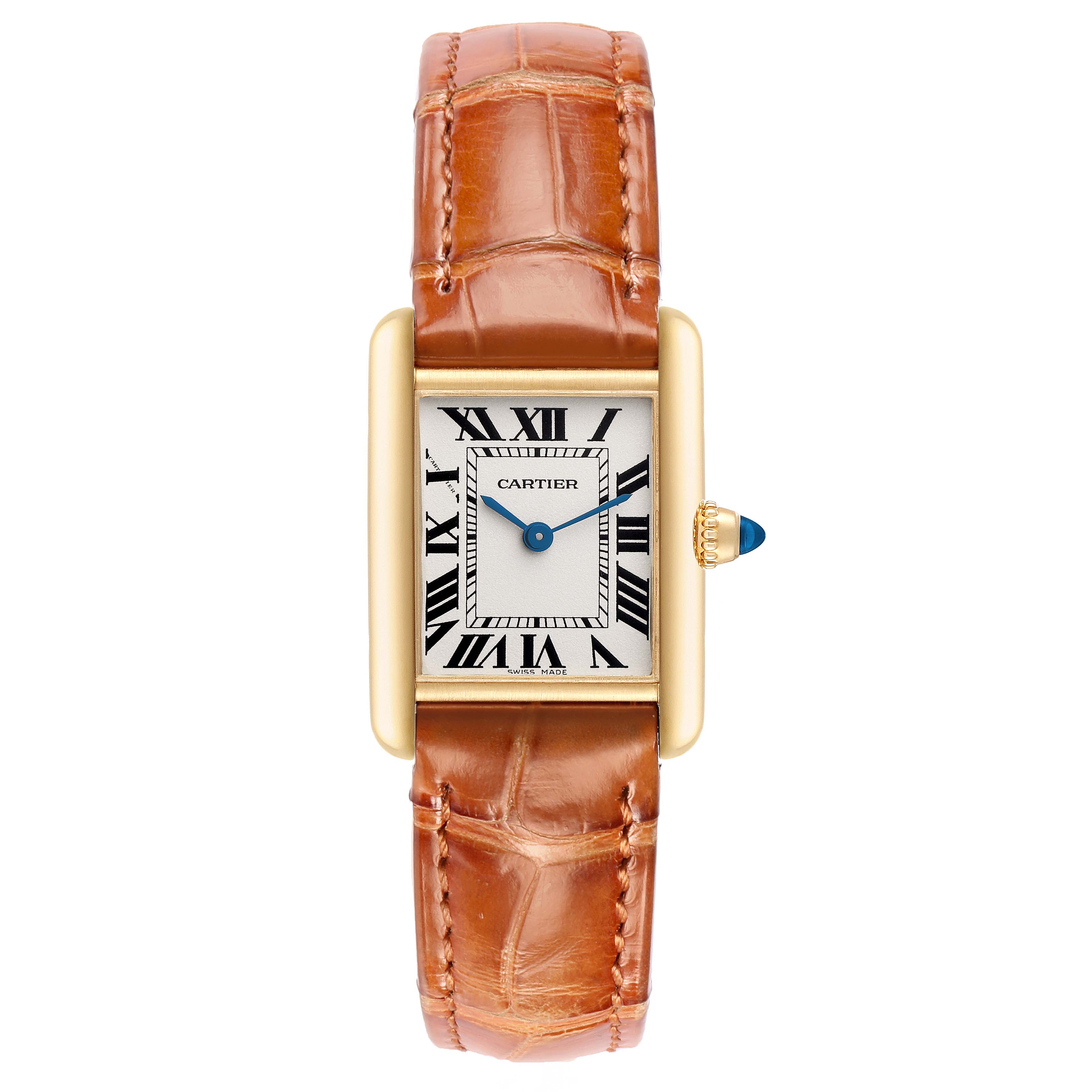 The Cartier Tank Louis W1529856 Women
s Yellow Gold Silver Dial watch is shown from a top-down angle, displaying its rectangular face, gold case, crown, and brown leather strap.