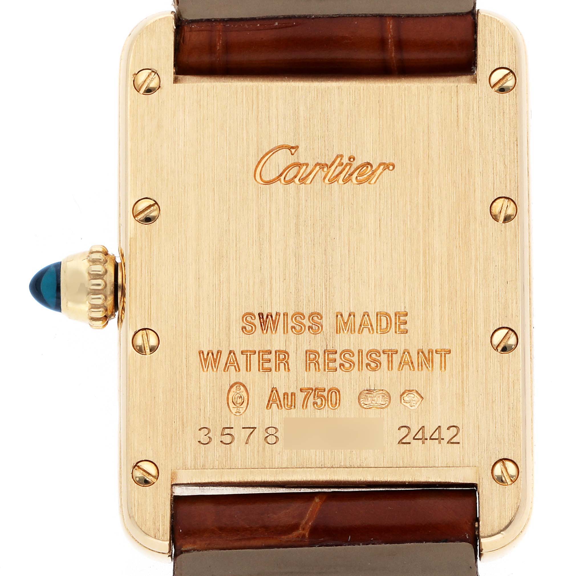 The image shows the back of a Cartier Tank Louis W1529856 Women
s Yellow Gold Silver Dial watch, featuring engravings and a blue cabochon crown.