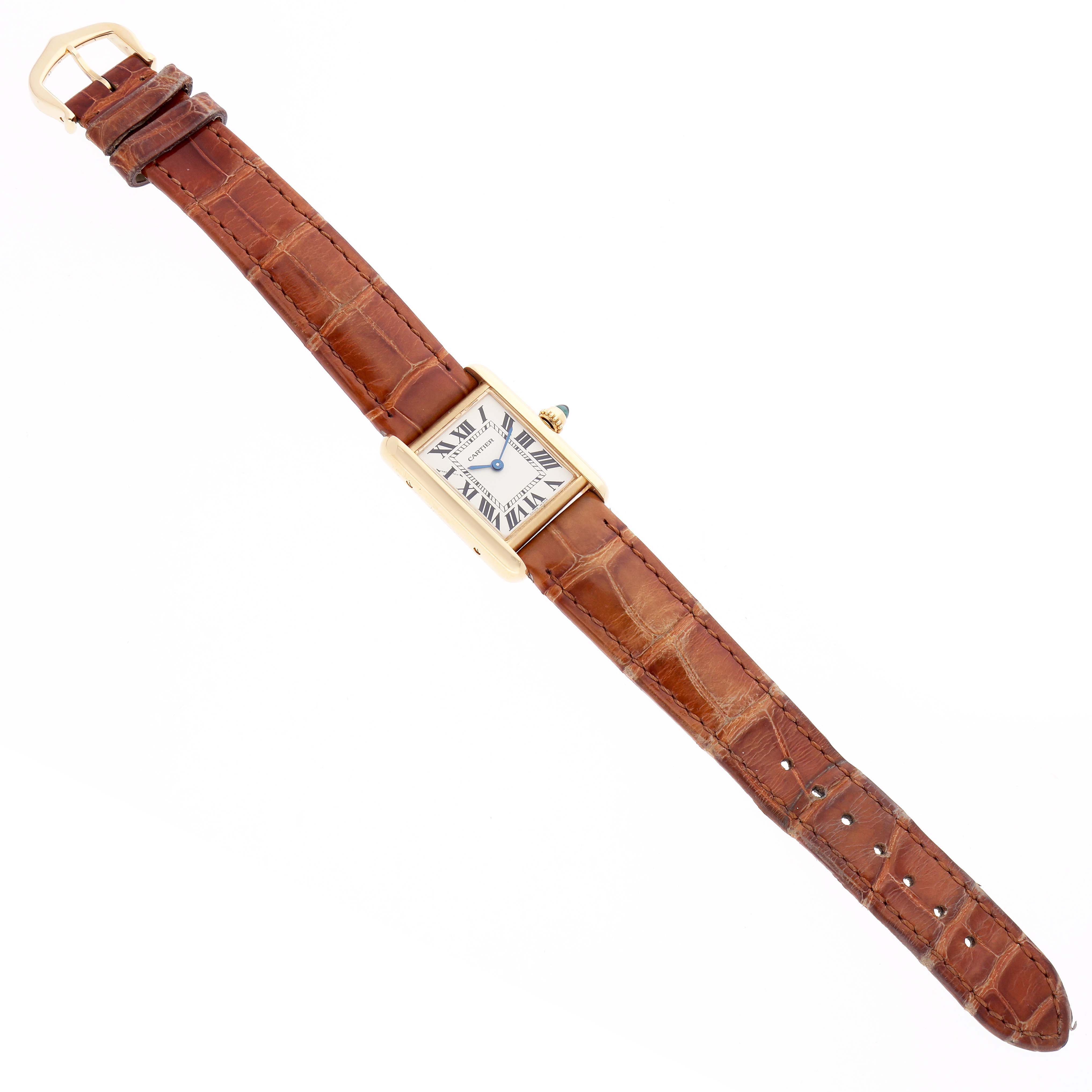 The Cartier Tank Louis W1529856 Women
s Yellow Gold Silver Dial watch is shown from a top angle, featuring its face, case, and full leather strap.