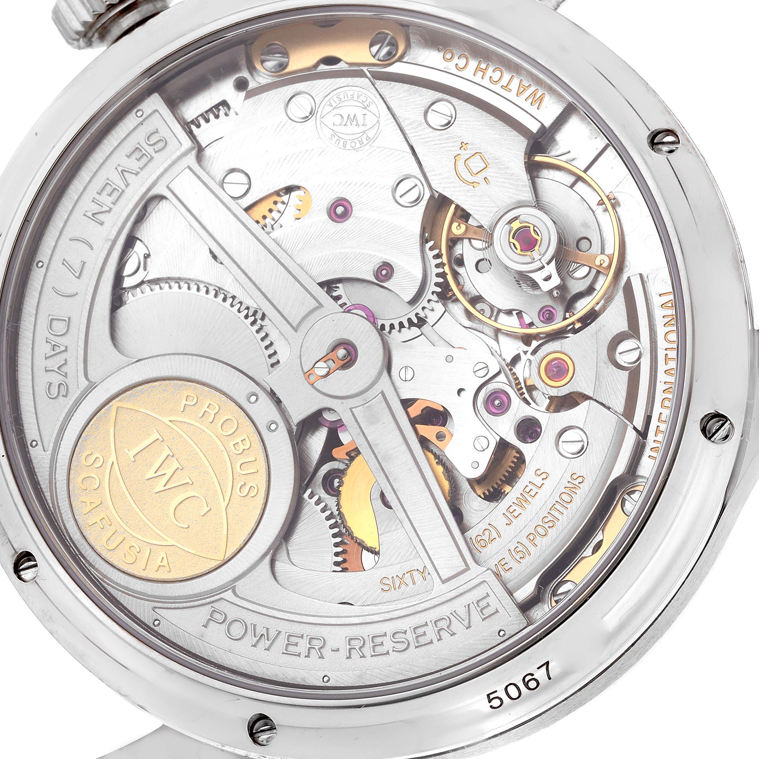 The image shows the back of an IWC Portuguese IW503203 Men's White Gold Blue Dial IW503203 Men's White Gold Blue Dial model watch, highlighting its intricate mechanical movement and parts.