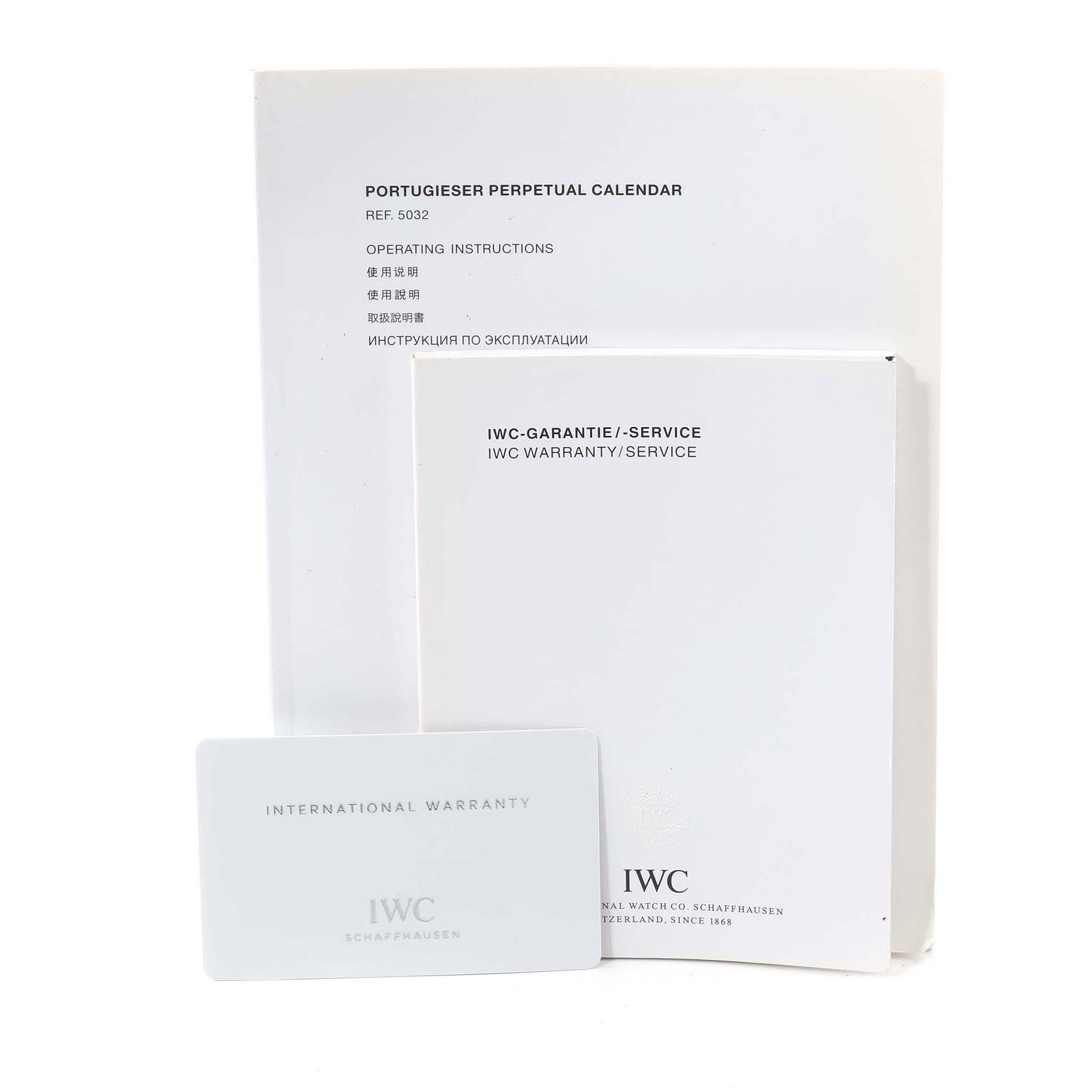 The image shows the operating instructions, guarantee/service booklet, and international warranty card for the IWC Portuguese IW503203 Men's White Gold Blue Dial IW503203 Men's White Gold Blue Dial Perpetual Calendar.