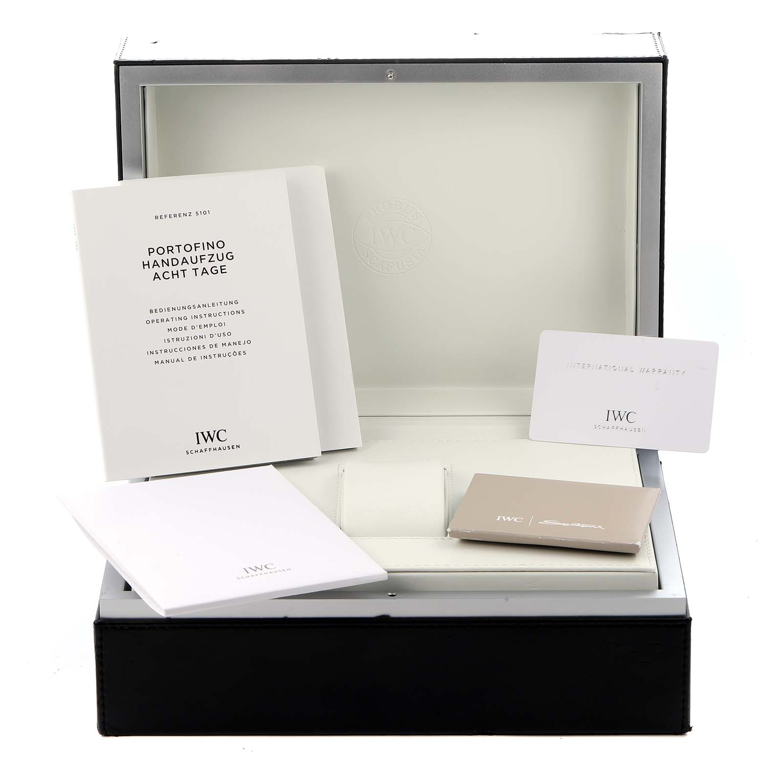 The image shows the IWC Portofino IW510103 Men
s Stainless Steel Silver Dial watch
s packaging with manuals, warranty card, and inner case from a frontal angle.