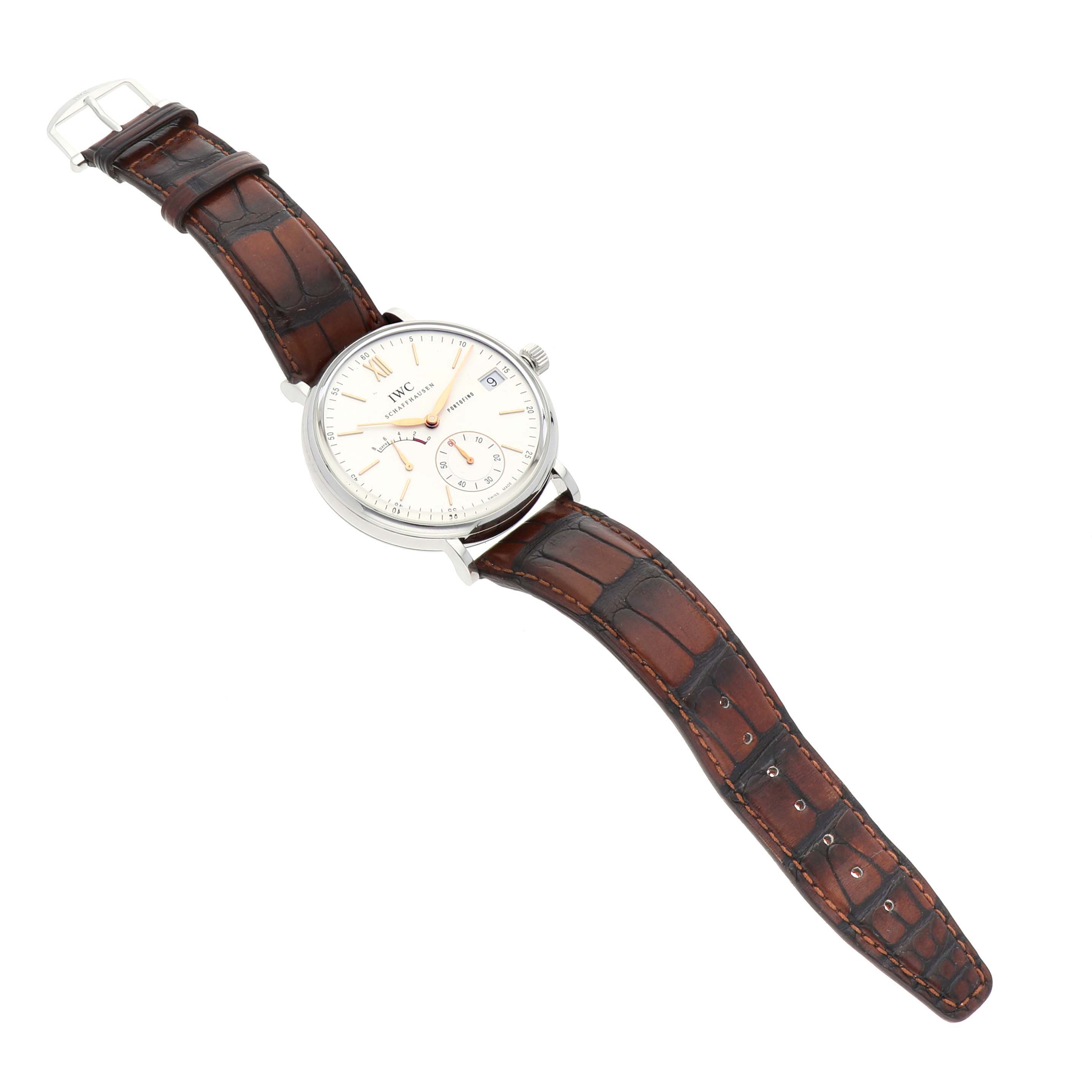 The IWC Portofino IW510103 Men
s Stainless Steel Silver Dial watch is shown at an oblique angle, displaying its face, case, crown, and leather strap.