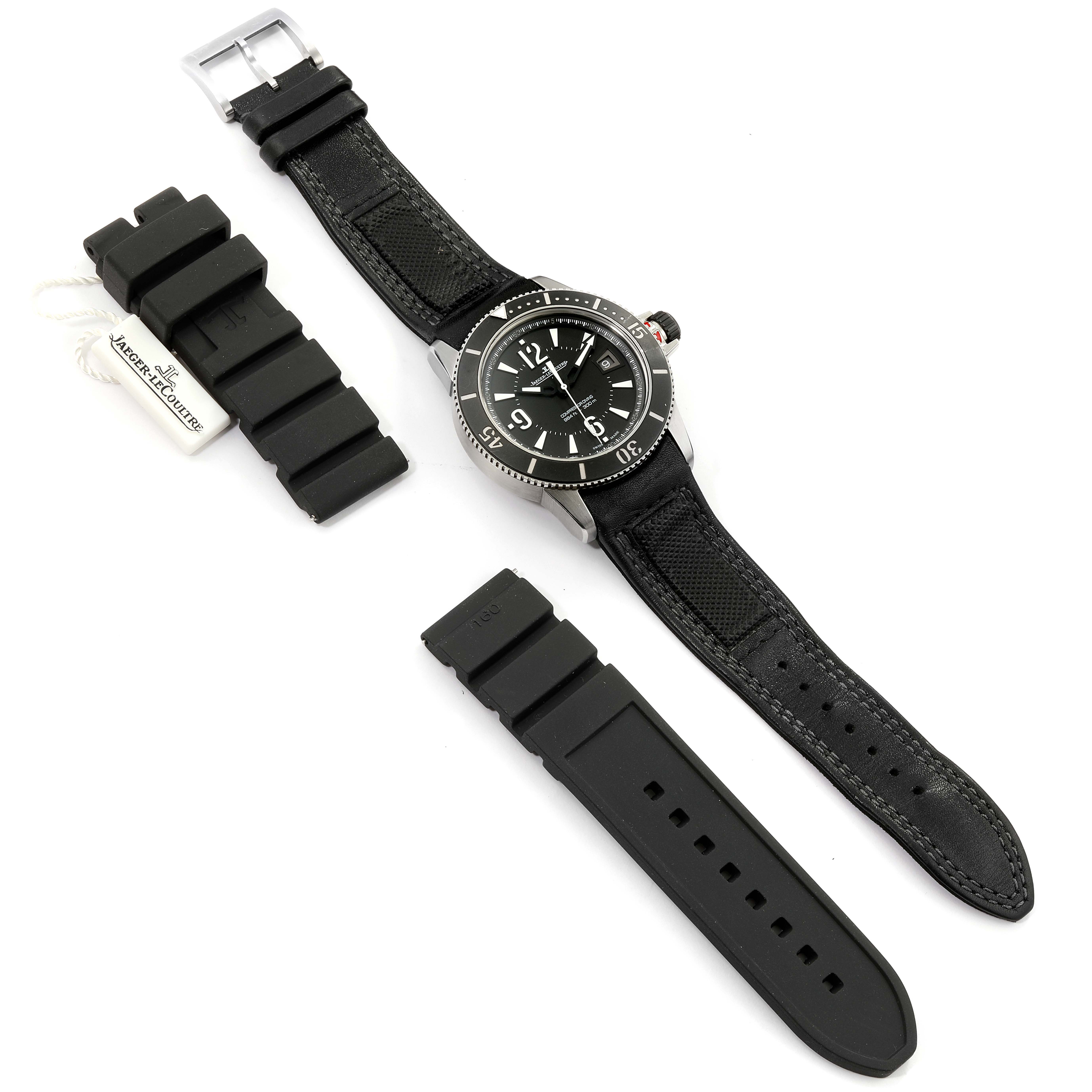 The image shows the Jaeger-LeCoultre Master model watch flat with additional black rubber straps and a Jaeger-LeCoultre tag.