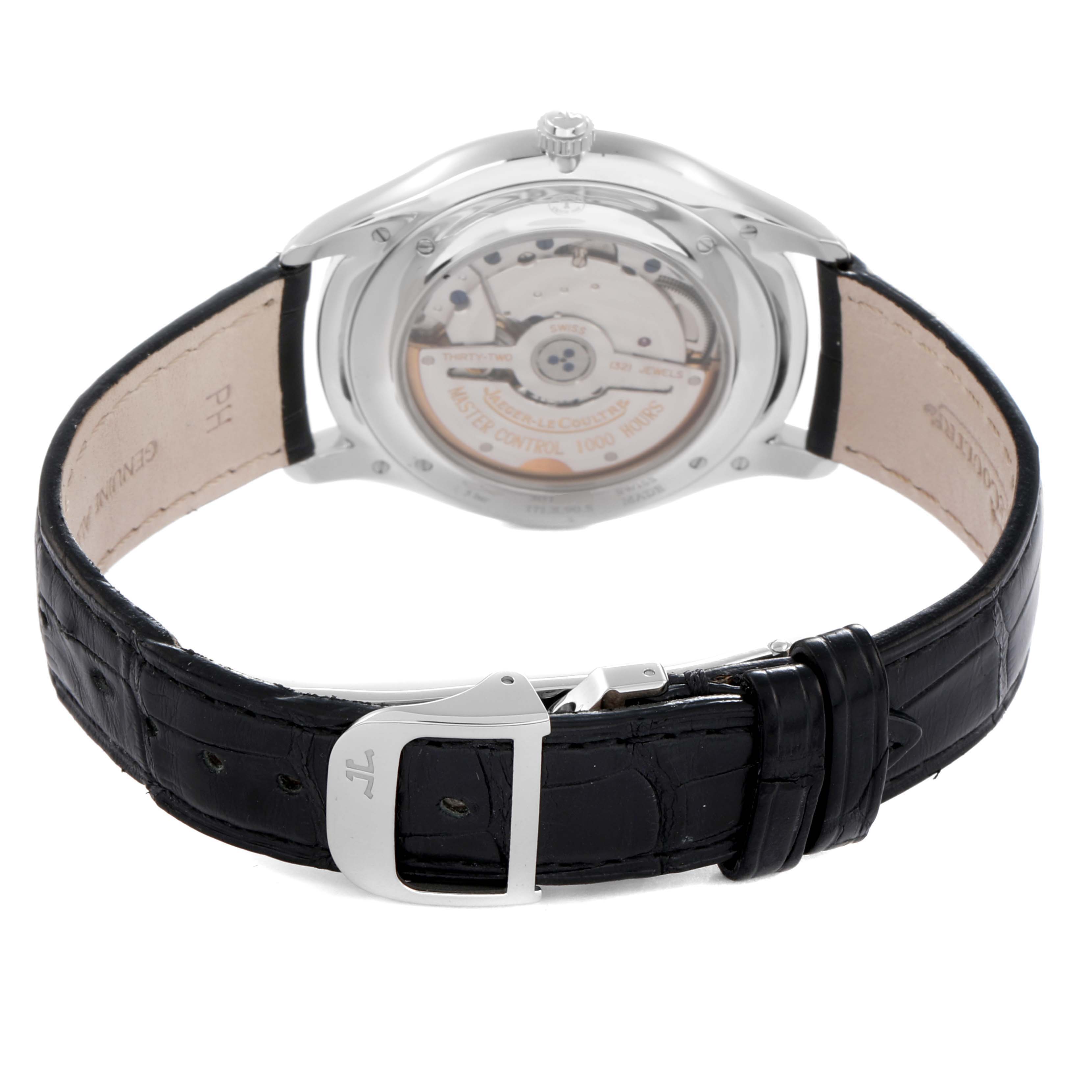 The Jaeger-LeCoultre Master watch is shown from the back, highlighting the movement and clasp of the leather strap.