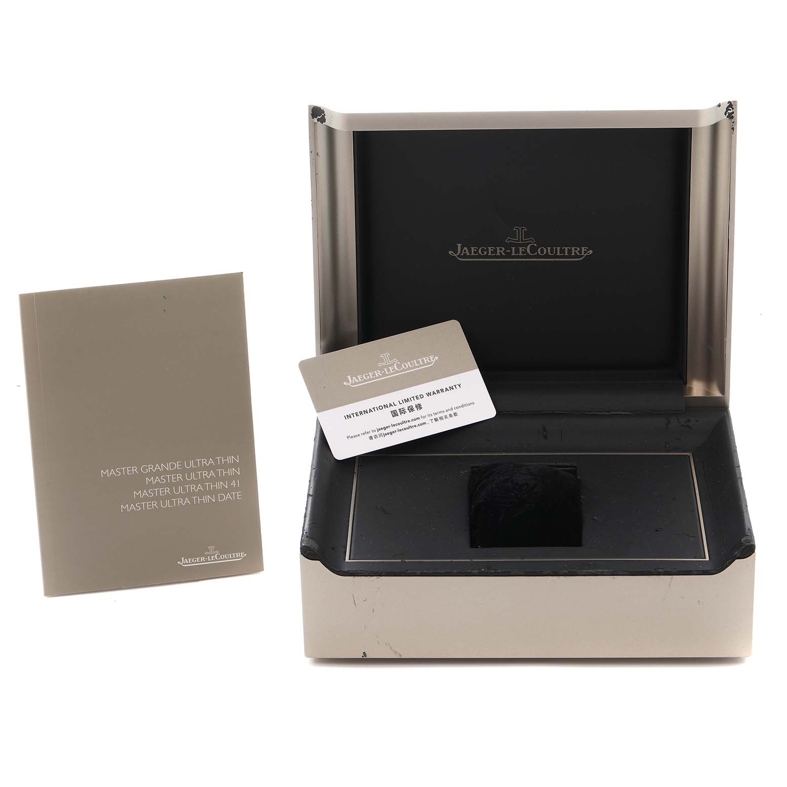 The image shows the Jaeger-LeCoultre Master model box, warranty card, and manual from a front angle.