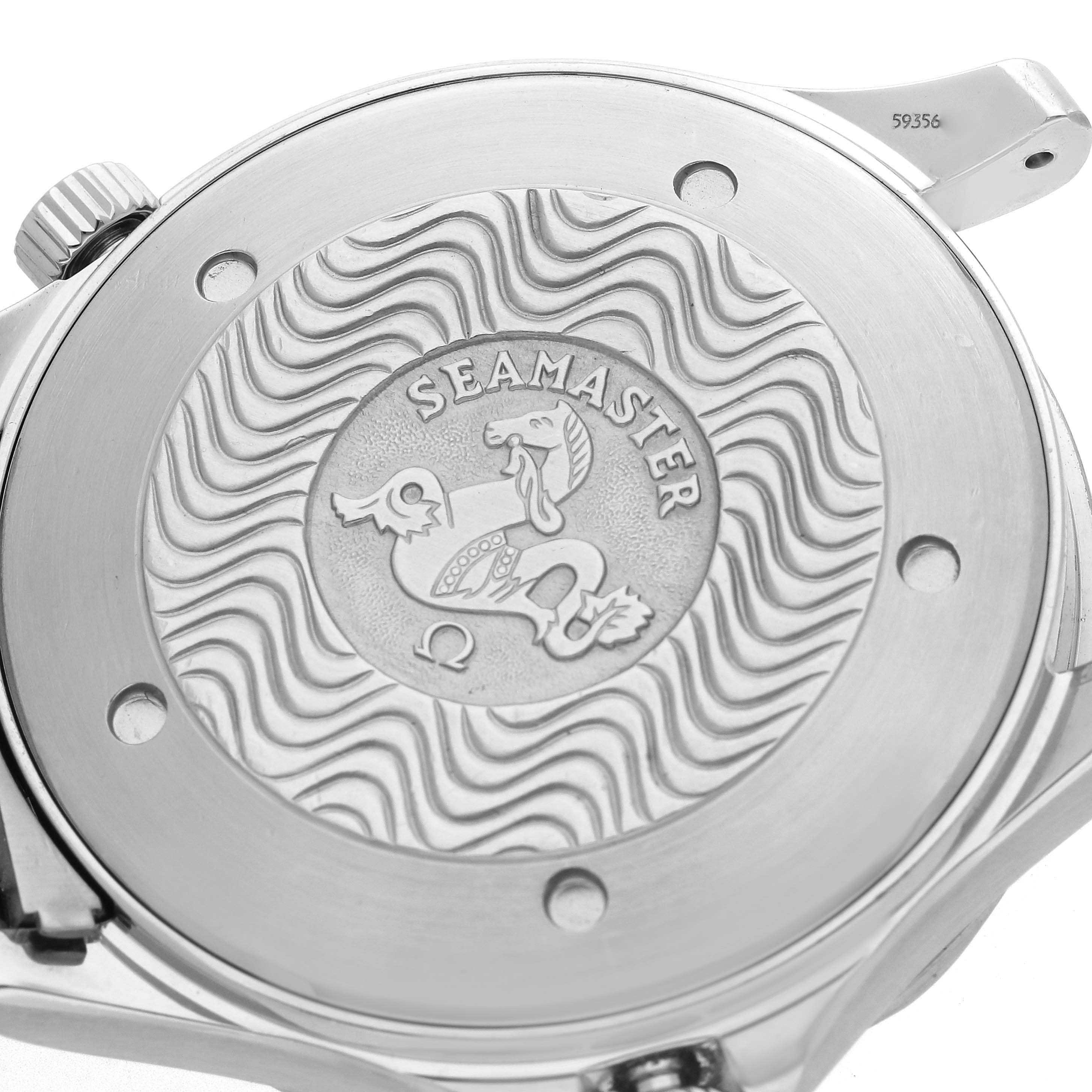 The image shows the back of the Omega Seamaster 2541.80.00 Men
s Stainless Steel Blue Dial watch, featuring its engraved logo and decorative wave pattern.
