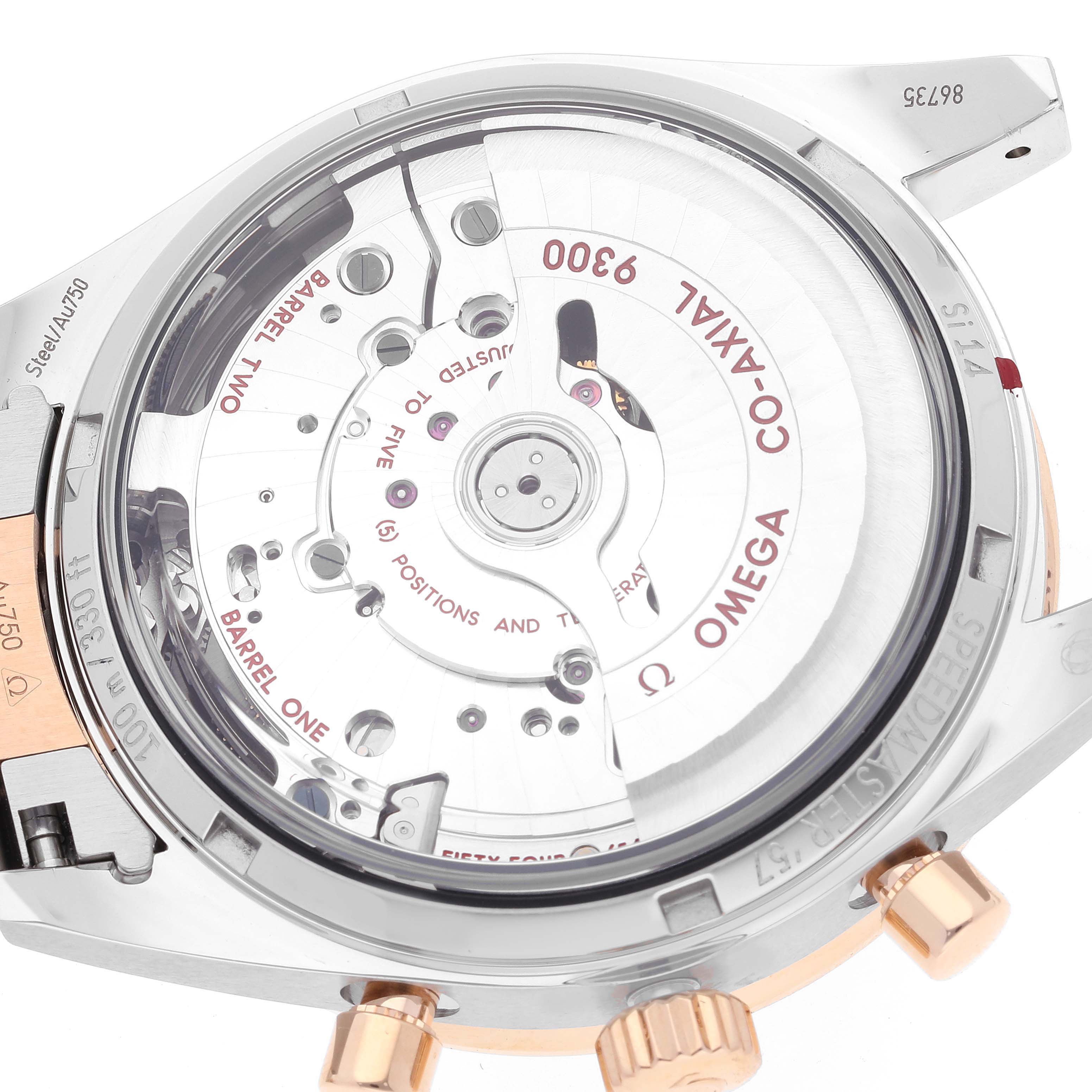 The image shows the backside of an Omega Speedmaster 331.20.42.51.01.002 Men's Steel and Gold (two tone) Black Dial 331.20.42.51.01.002 Men's Steel and Gold (two tone) Black Dial watch, highlighting its Co-Axial 9300 movement and internal mechanisms.