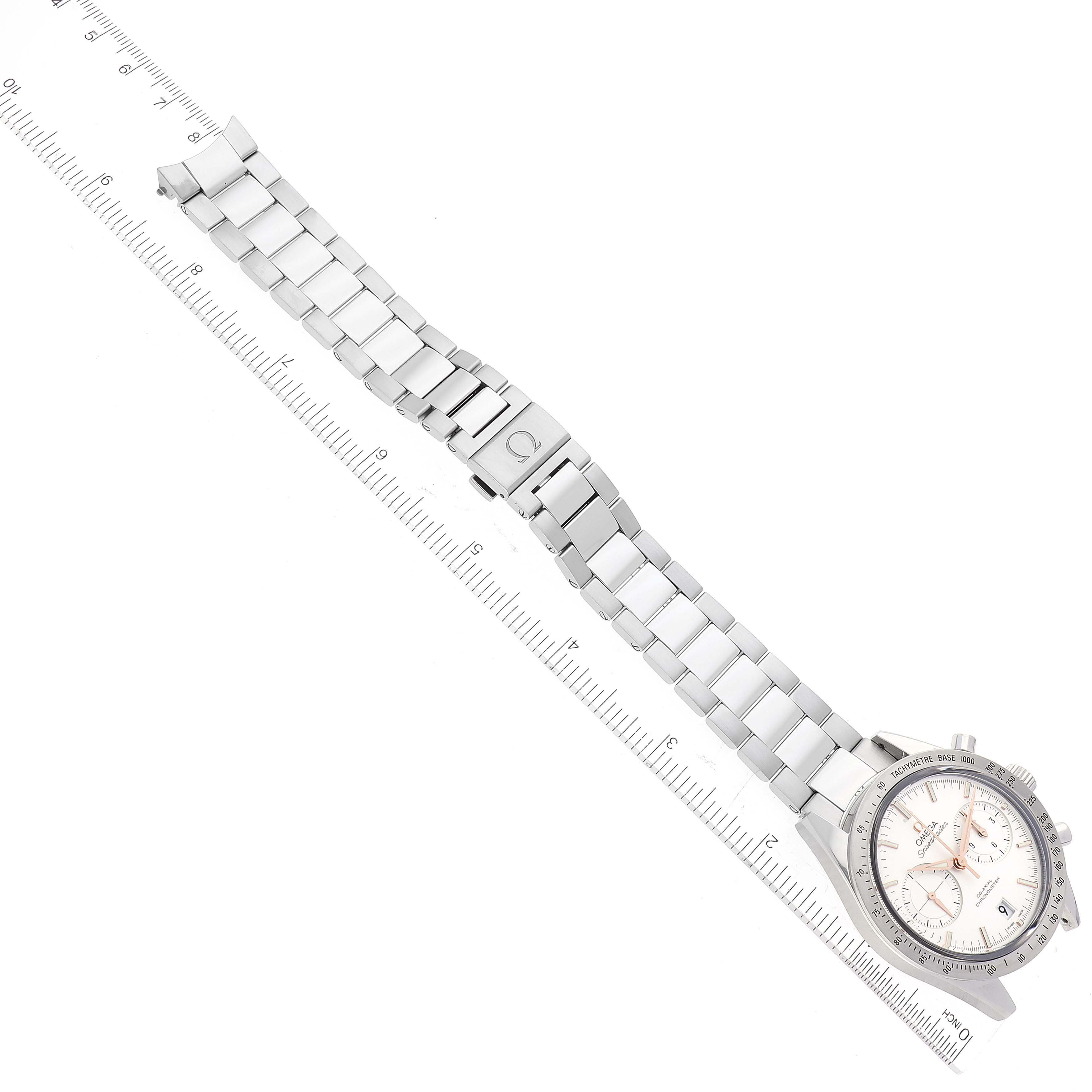 The image shows an Omega Speedmaster 331.10.42.51.02.002 Men
s Stainless Steel Silver Dial 331.10.42.51.02.002 Men
s Stainless Steel Silver Dial watch laid flat with its metal bracelet extended next to a ruler for scale.