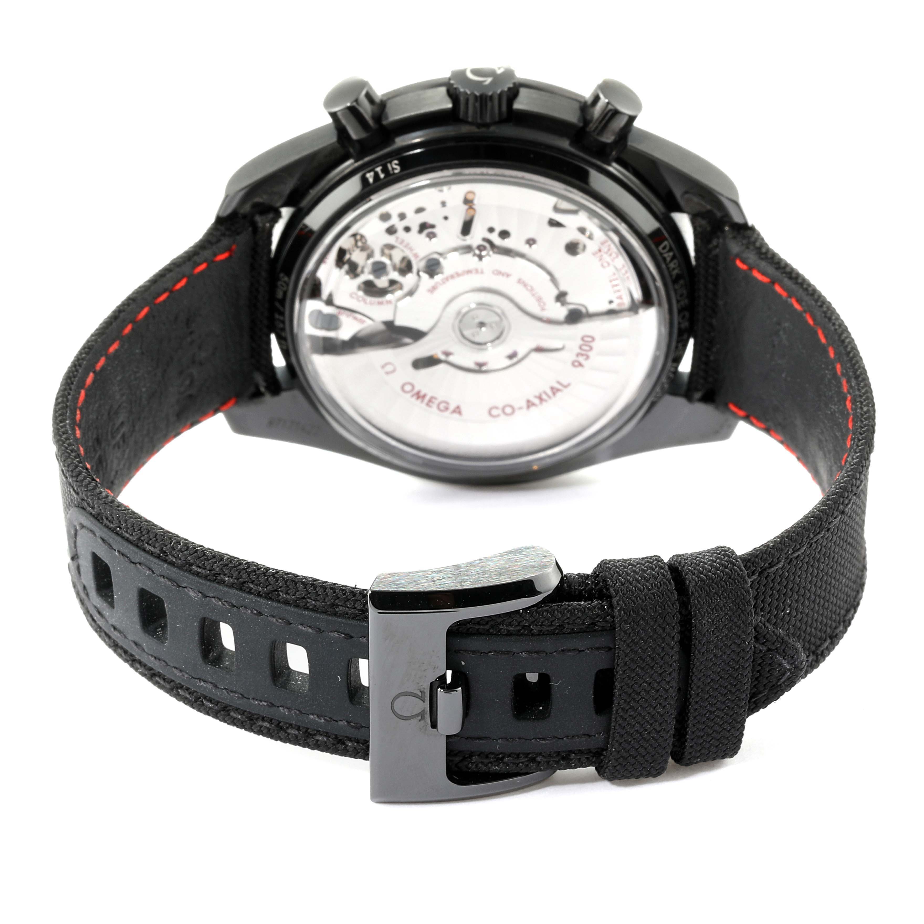 The image shows the back view of an Omega Speedmaster 311.92.44.51.01.003 Men's Titanium Black Dial 311.92.44.51.01.003 Men's Titanium Black Dial watch, highlighting its open case back and strap buckle.