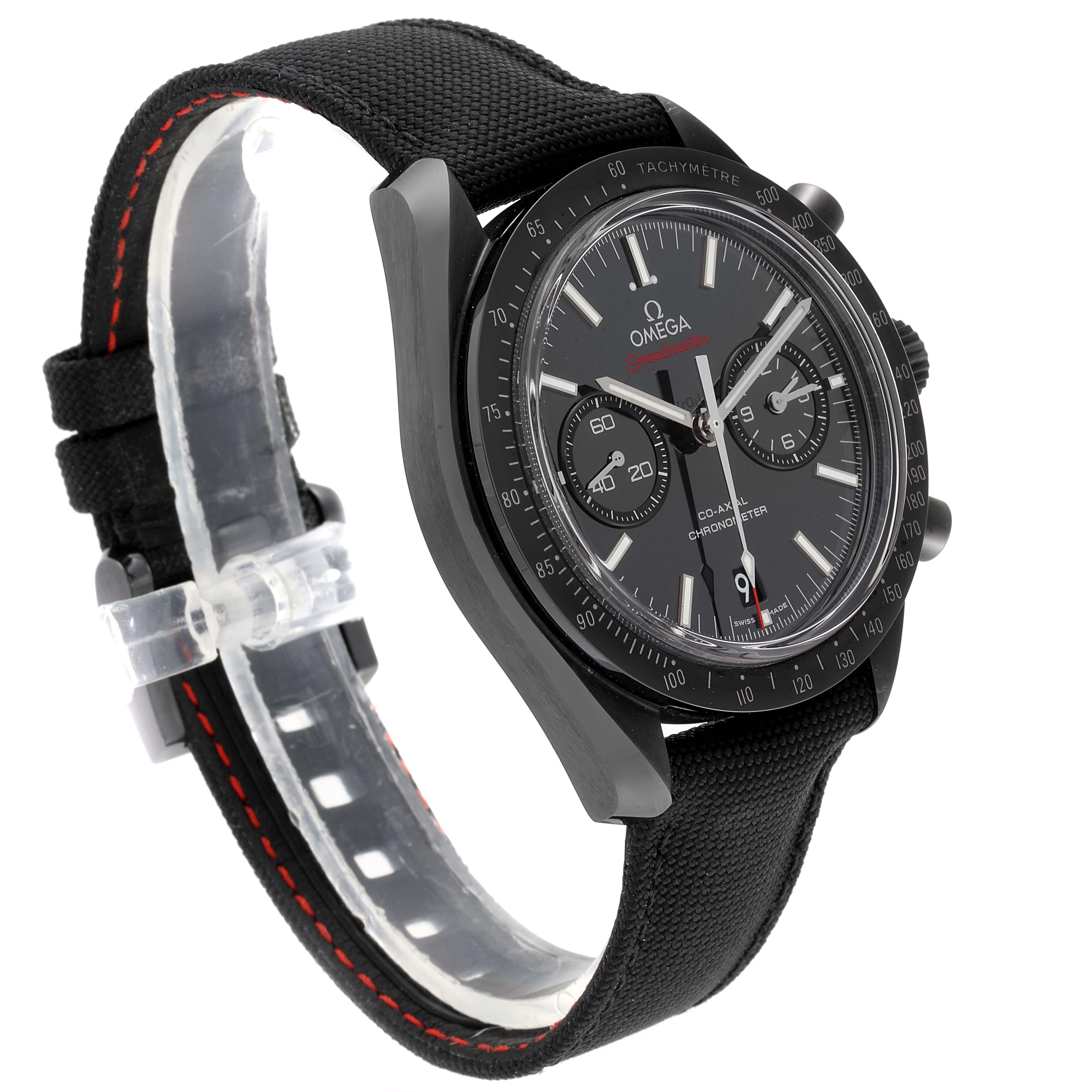 This image shows a side angle of an Omega Speedmaster 311.92.44.51.01.003 Men's Titanium Black Dial 311.92.44.51.01.003 Men's Titanium Black Dial watch, highlighting the dial, bezel, and fabric strap with red stitching.