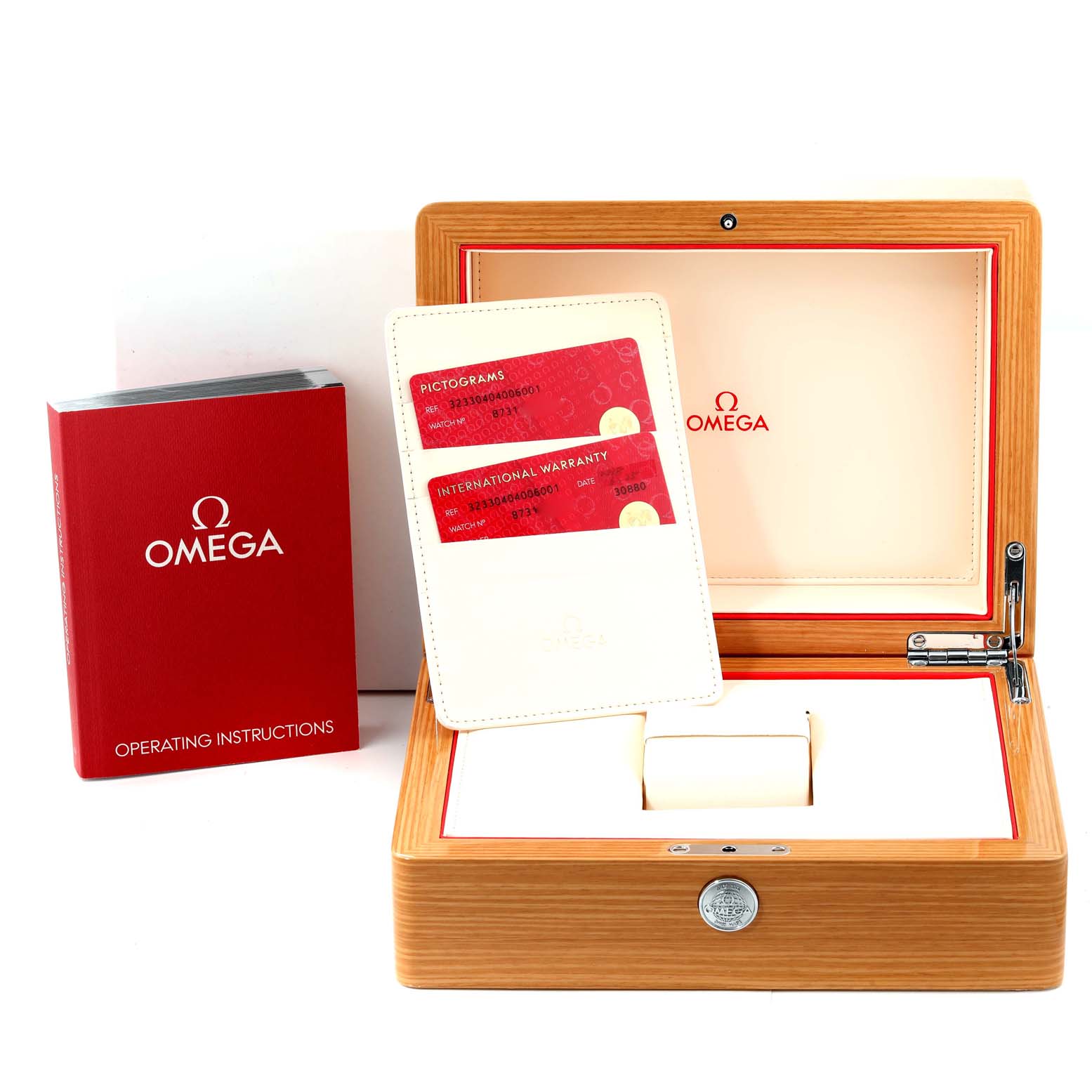 The image shows the Omega Speedmaster 323.30.40.40.06.001 Men's Stainless Steel Grey Dial 323.30.40.40.06.001 Men's Stainless Steel Grey Dial watch box, warranty cards, and operating instructions, viewed from the front.