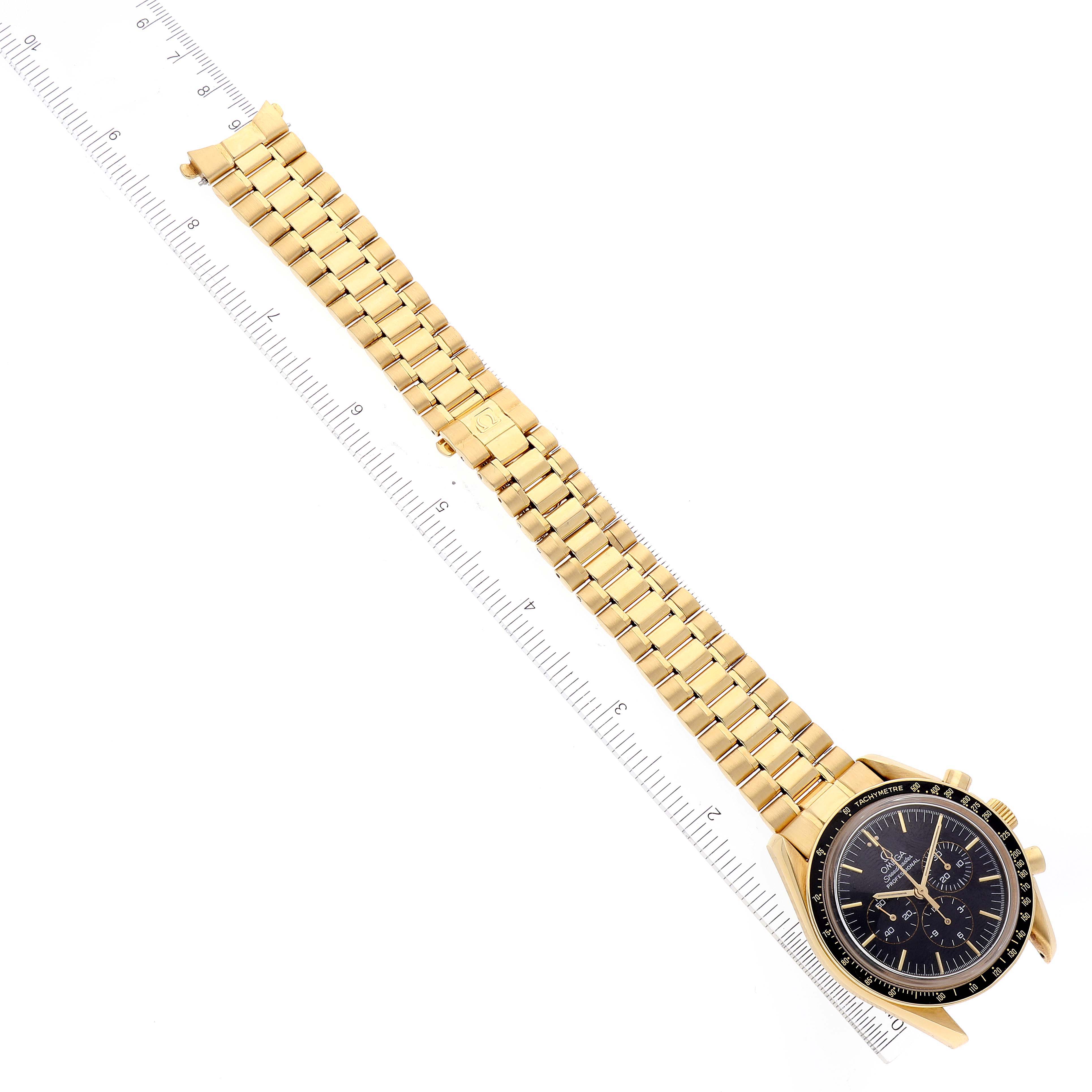 The Omega Speedmaster 3191.50 Men's Yellow Gold Black Dial watch is shown from an angled overhead view, highlighting its gold bracelet and black dial.