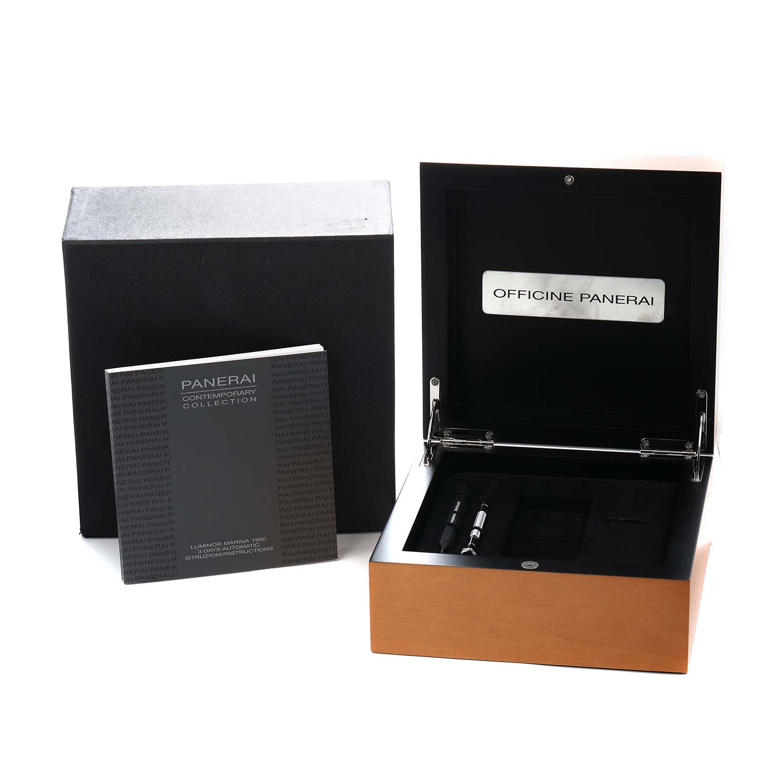 The image shows a Panerai Luminor PAM00351 Men
s Titanium Brown Dial box and booklet, viewed from above, with compartments and watch tools inside.