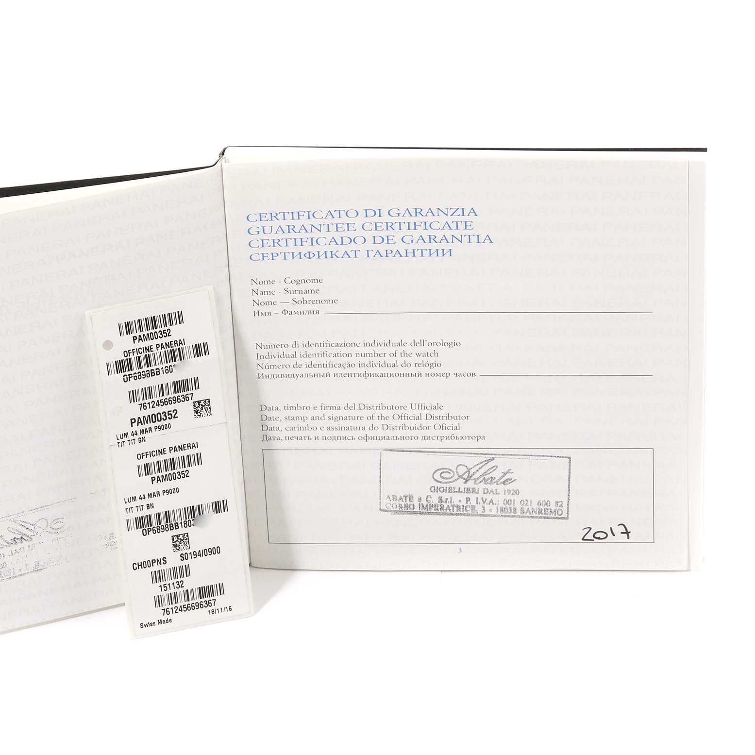 The image shows the warranty certificate and identification labels for a Panerai Luminor PAM00352 Men
s Titanium Brown Dial PAM00352 Men
s Titanium Brown Dial model watch.