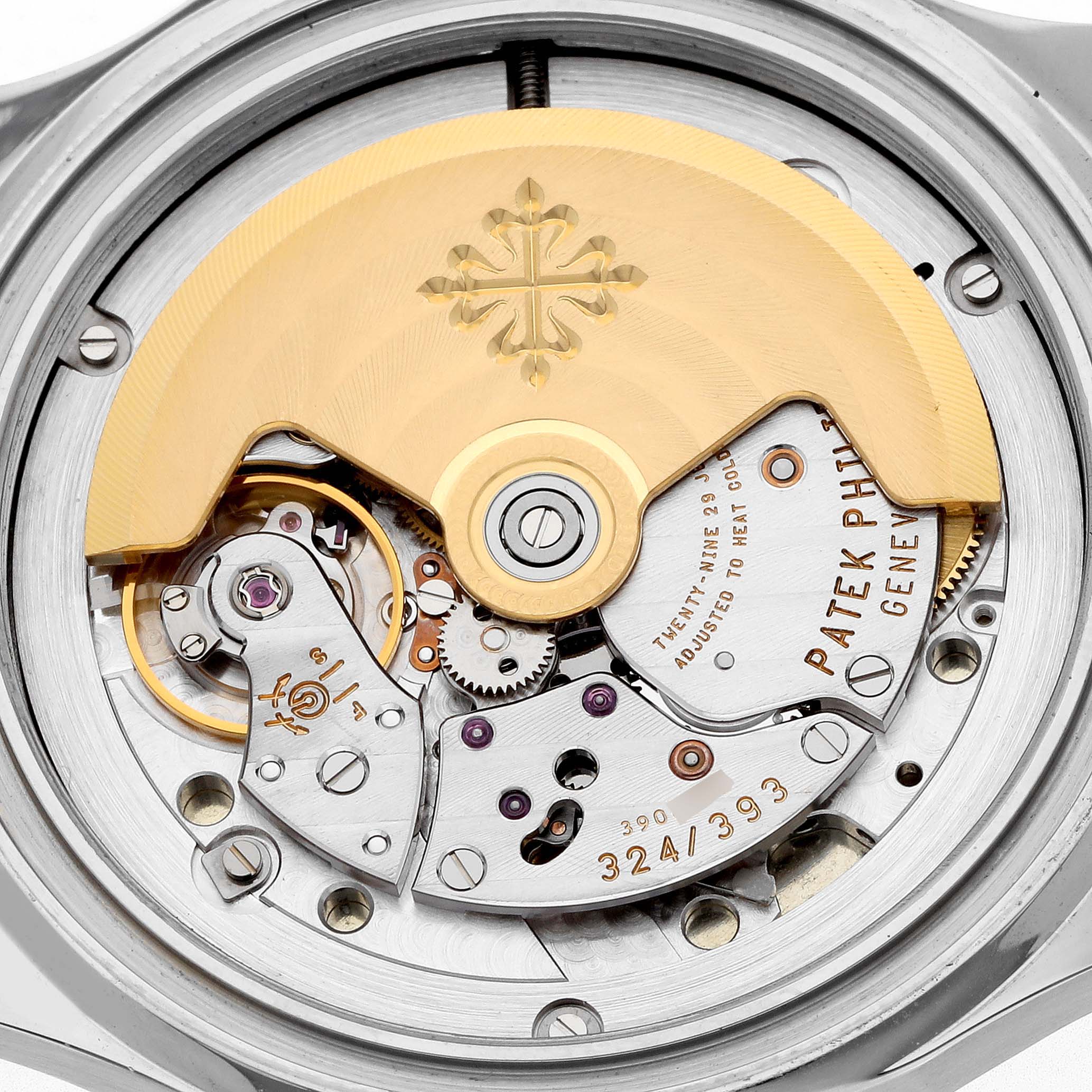 The Patek Philippe Aquanaut 5165A Men
s Stainless Steel Grey Dial model is shown from the back, highlighting the intricate automatic movement and rotor.