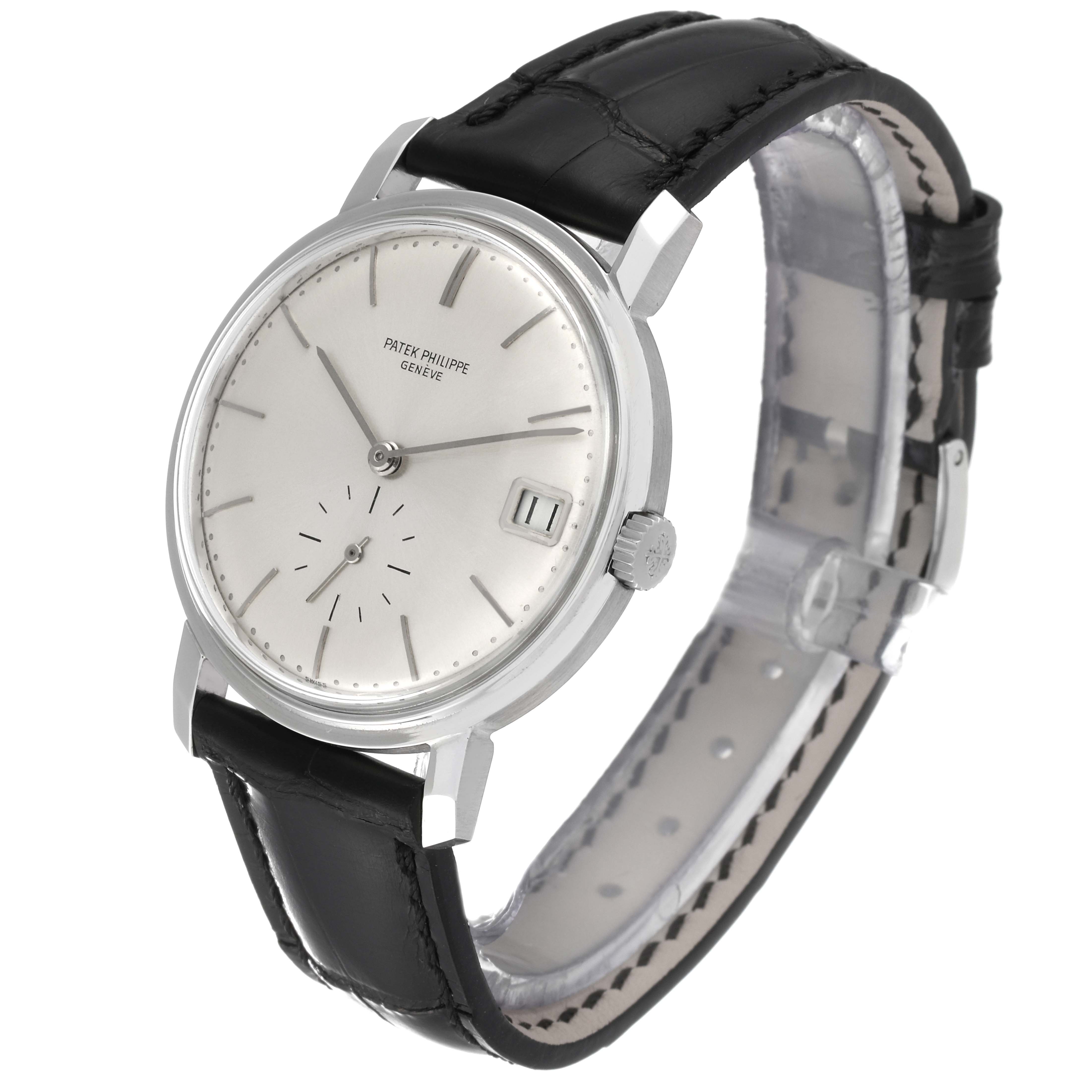 The image shows a Patek Philippe Vintage watch at a left angled front view displaying its face, dial, hands, case, and black leather strap.