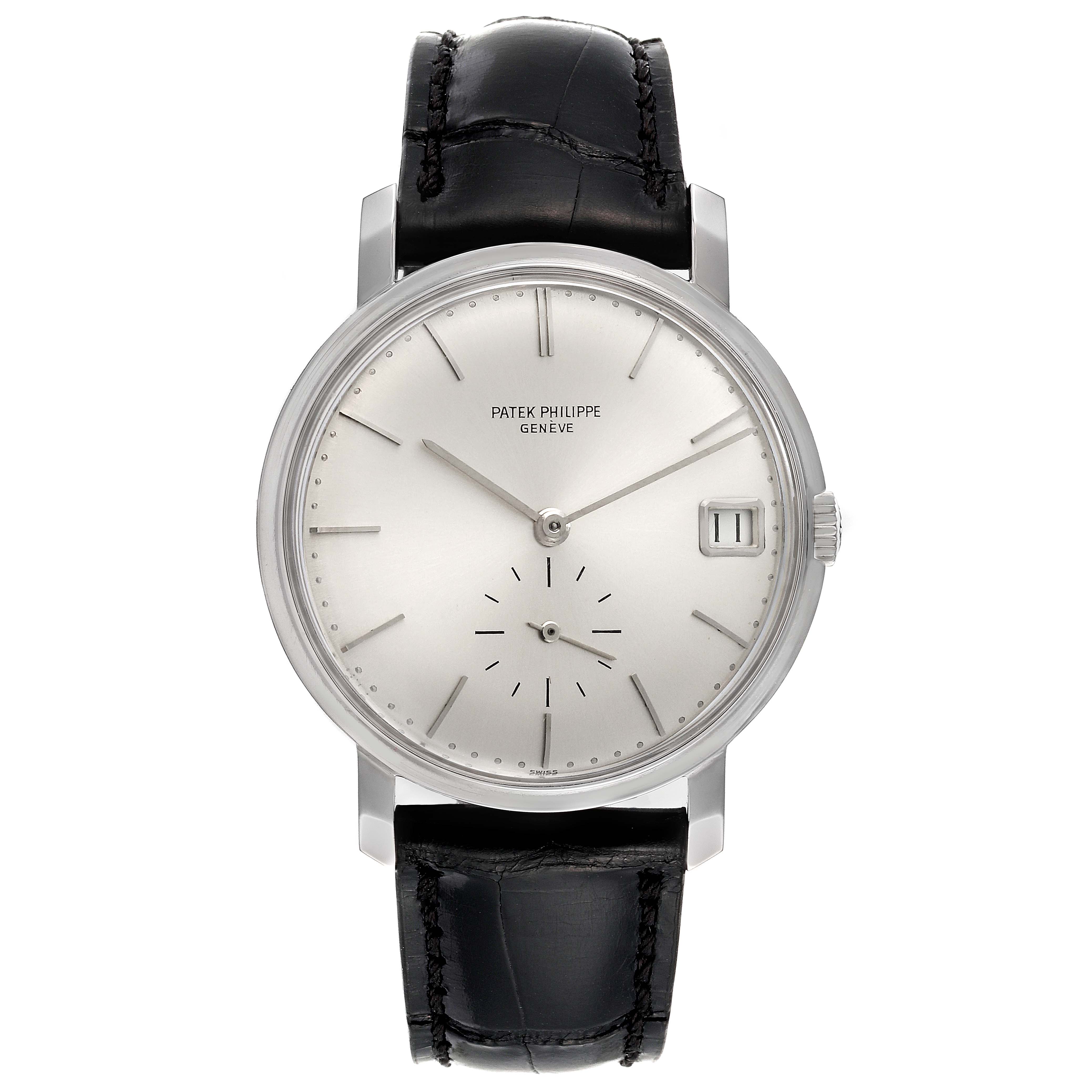 The image shows a front view of a Vintage Patek Philippe watch, highlighting its dial, hands, case, crown, and black leather strap.