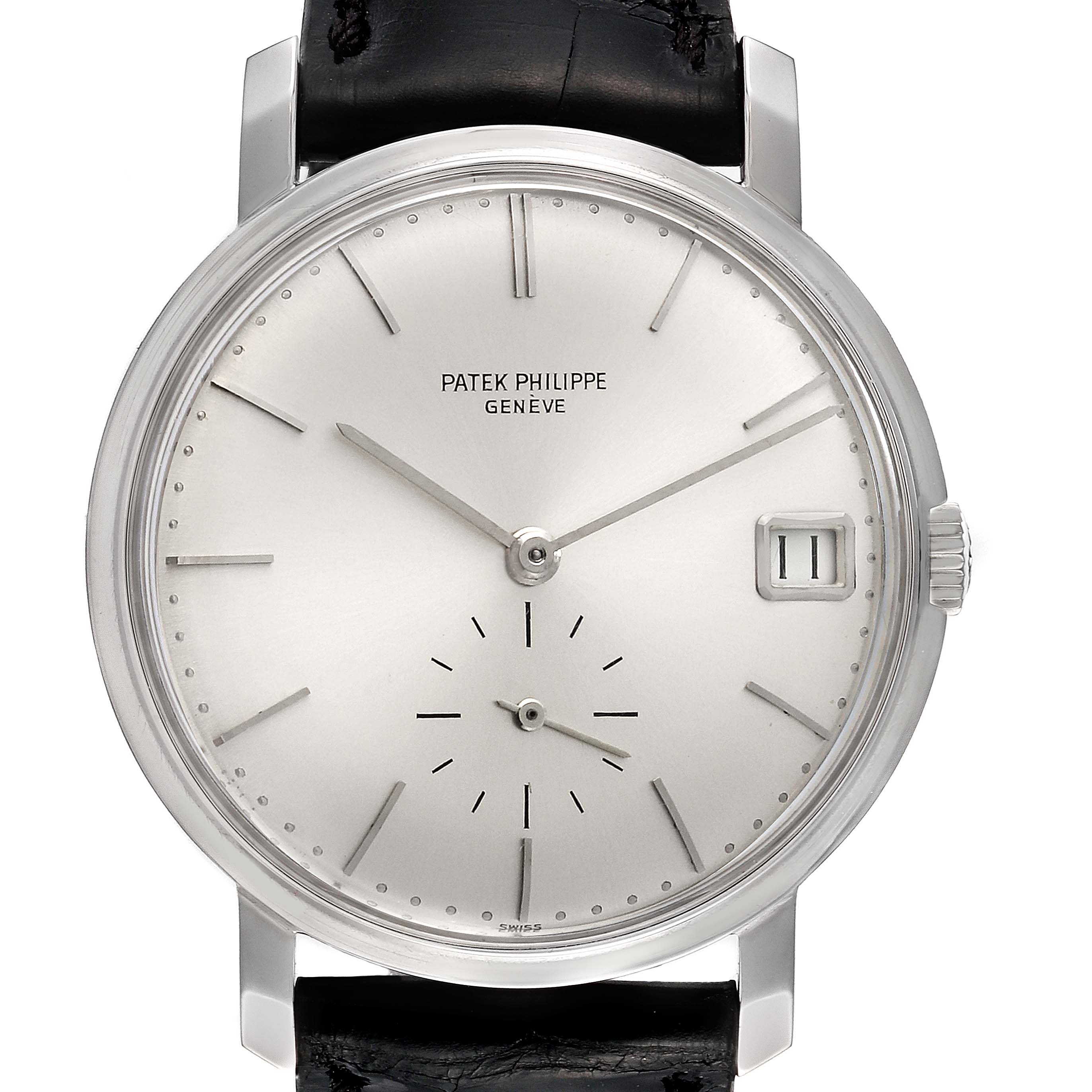 The image shows a frontal view of a Calatrava model by Patek Philippe, displaying the dial, hands, and date window.