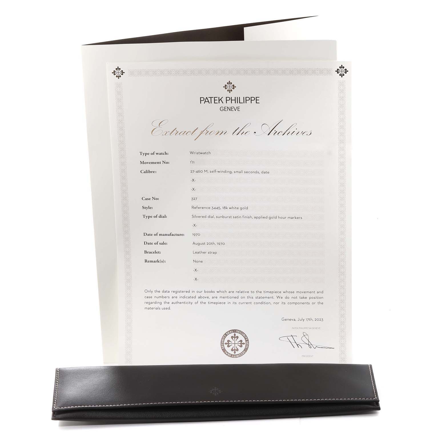 The image shows documents and a leather case for a Vintage Patek Philippe watch, viewed from an overhead angle.