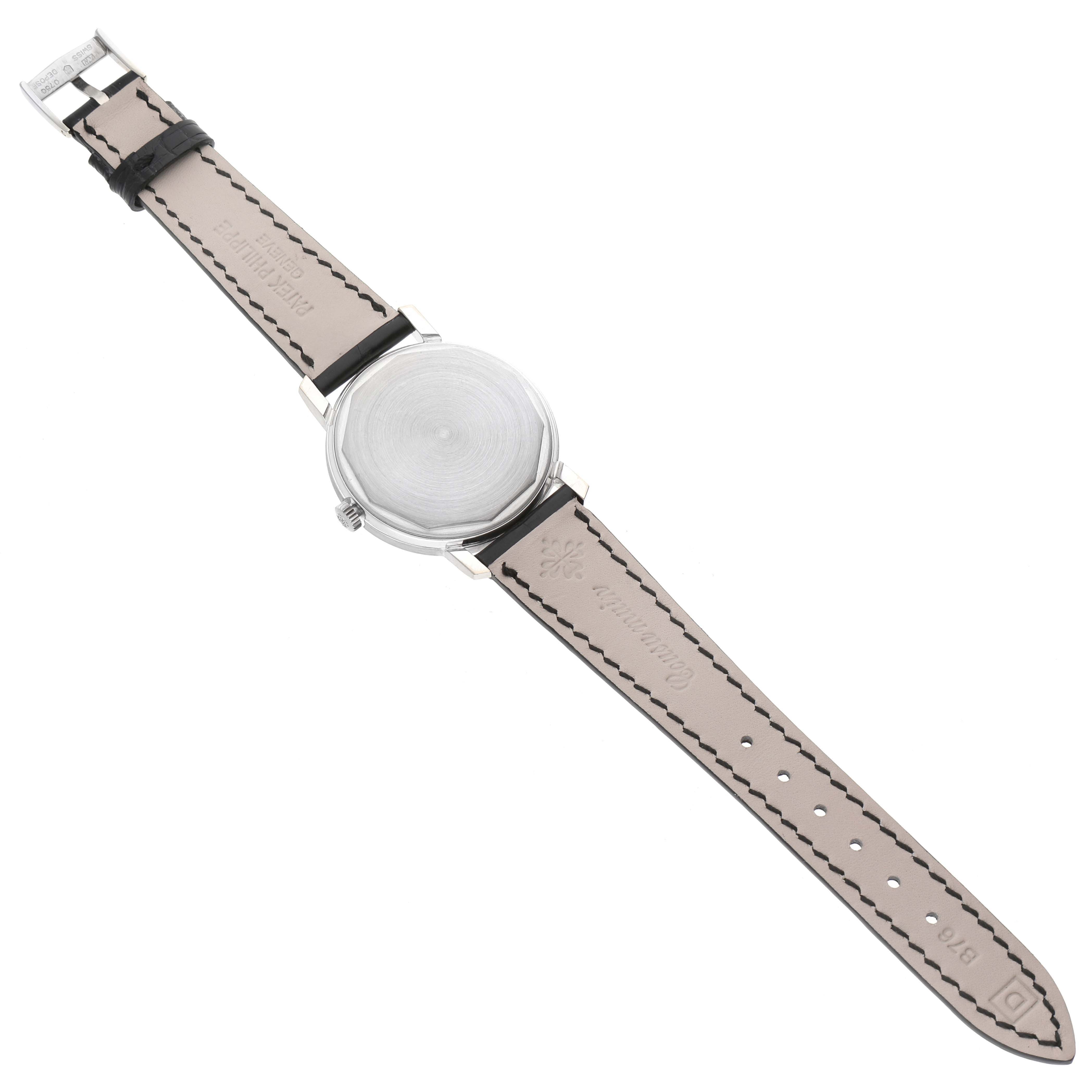 This image shows the back and strap of a Vintage Patek Philippe watch, laid flat with its buckle and brand engraving visible.