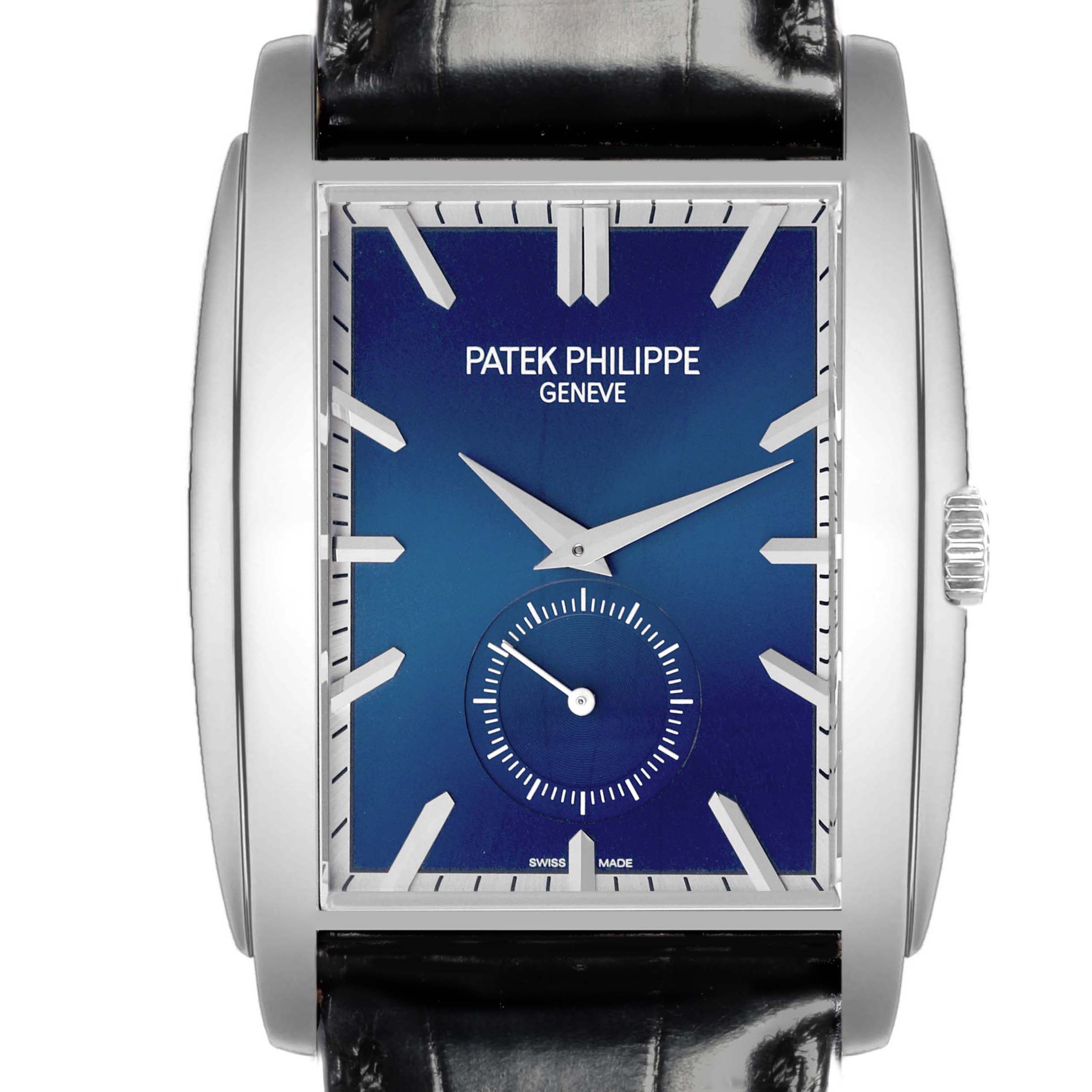 The image shows a front view of the Patek Philippe Gondolo 5124G-011 Men's White Gold Blue Dial watch, highlighting its blue dial, rectangular case, and black leather strap.