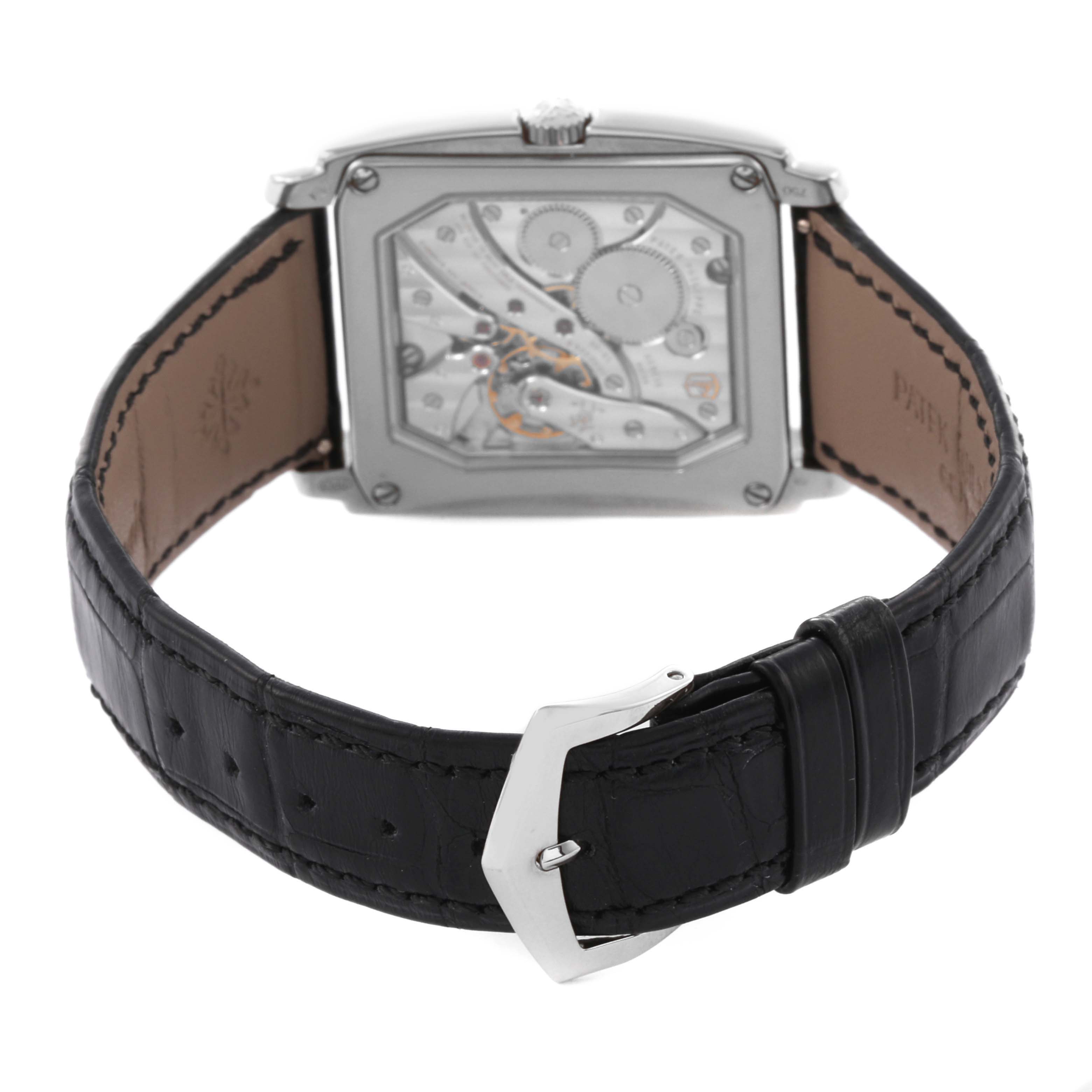 The image shows the back view of a Patek Philippe Gondolo 5124G-011 Men's White Gold Blue Dial watch, highlighting its movement and black leather strap.