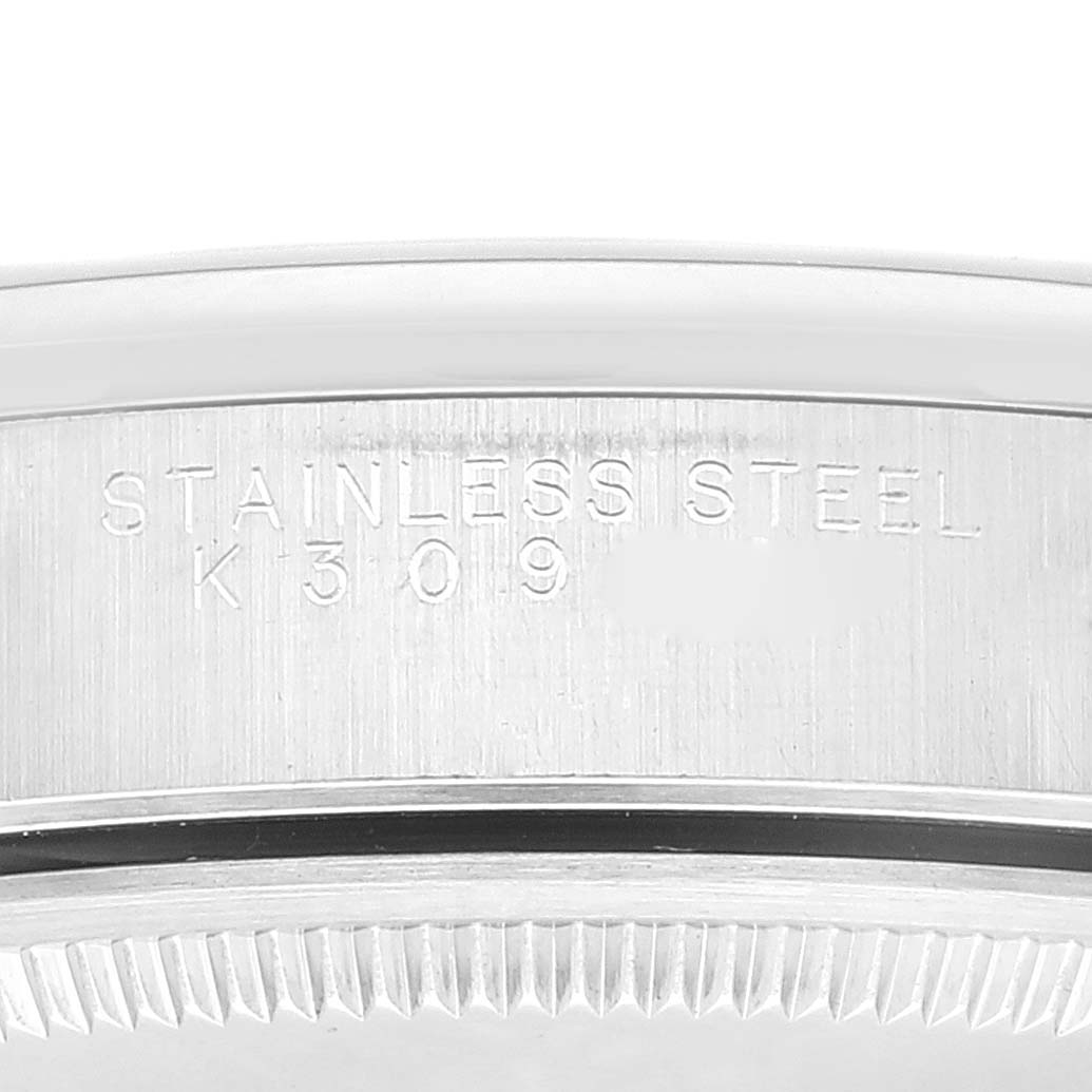 The image depicts a close-up of the stainless steel casing of the Rolex Air-King 14000 Men's Stainless Steel Black Dial 14000 Men's Stainless Steel Black Dial watch, showing the engravings.