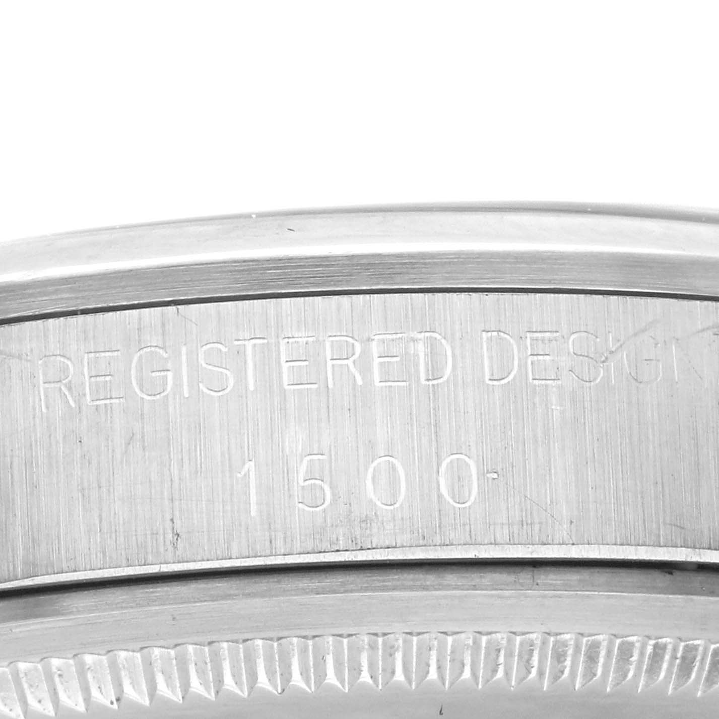 This image shows the case side view of a Rolex Vintage Collection 1500 Men's Stainless Steel Blue Dial 1500 Men's Stainless Steel Blue Dial model with engraved text "REGISTERED DESIGN 1500" and part of the bezel.