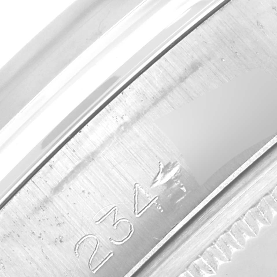 The image shows a close-up of the engraved edge of a Rolex Vintage Collection 1500 Men's Stainless Steel Brown Dial 1500 Men's Stainless Steel Brown Dial watch.