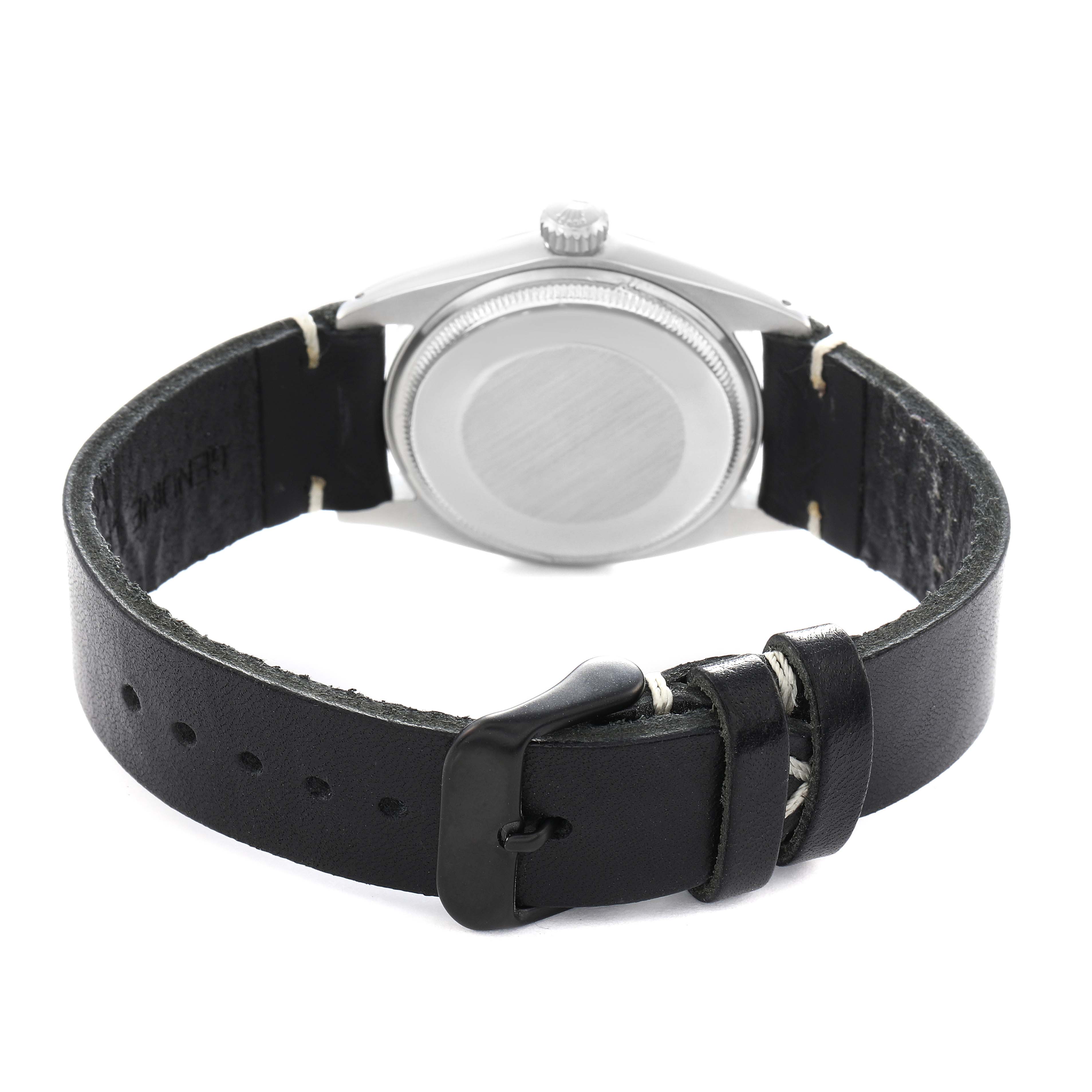 The Rolex Date 1500 Men
s Stainless Steel Black Dial watch is shown from the back, highlighting the rear case and the black leather strap with buckle.