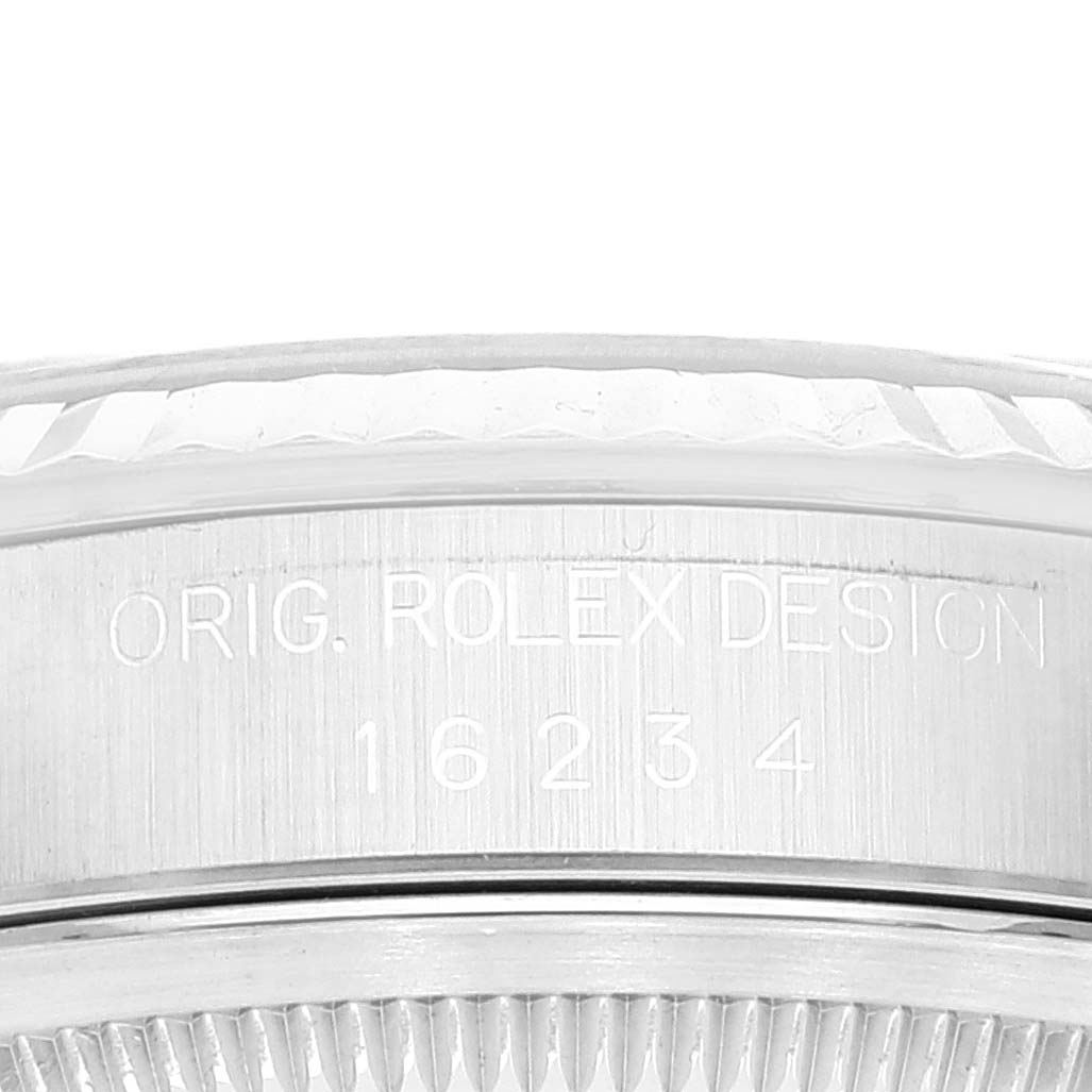 This close-up image shows the side engraving on a Rolex Datejust 16234 Men's Stainless Steel Black Dial 16234 Men's Stainless Steel Black Dial model, highlighting the "ORIG. ROLEX DESIGN" and the reference number 16234.