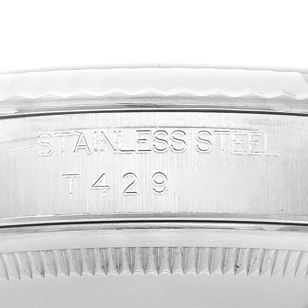 This close-up image shows the side edge and serial number engraving on a stainless steel Rolex Datejust 16234 Men's Stainless Steel Black Dial 16234 Men's Stainless Steel Black Dial watch.