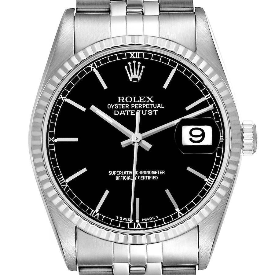 The image shows a frontal view of a Rolex Datejust watch, displaying its black dial, fluted bezel, date window, and stainless steel bracelet.