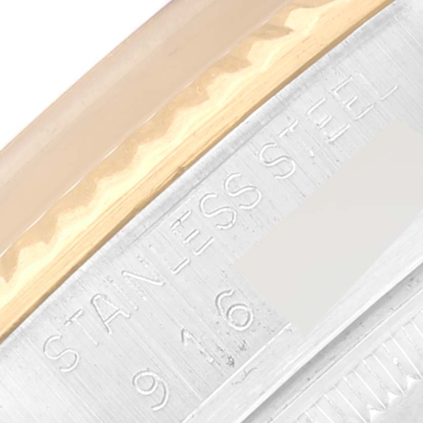 The image shows a close-up angle of the side of a Rolex Vintage Collection 16013 Men's Steel and Gold (two tone) Black Dial 16013 Men's Steel and Gold (two tone) Black Dial watch, highlighting the "Stainless Steel" marking.