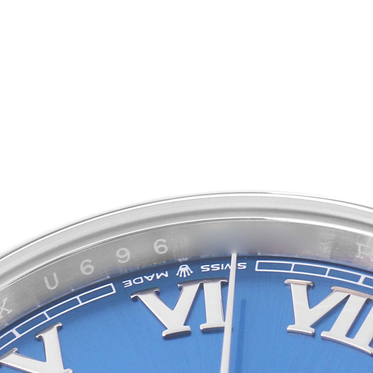 The image shows a partial view of a Rolex Datejust 41 126300 Men
s Stainless Steel Blue Dial watch face, focusing on the blue dial and Roman numeral markers.