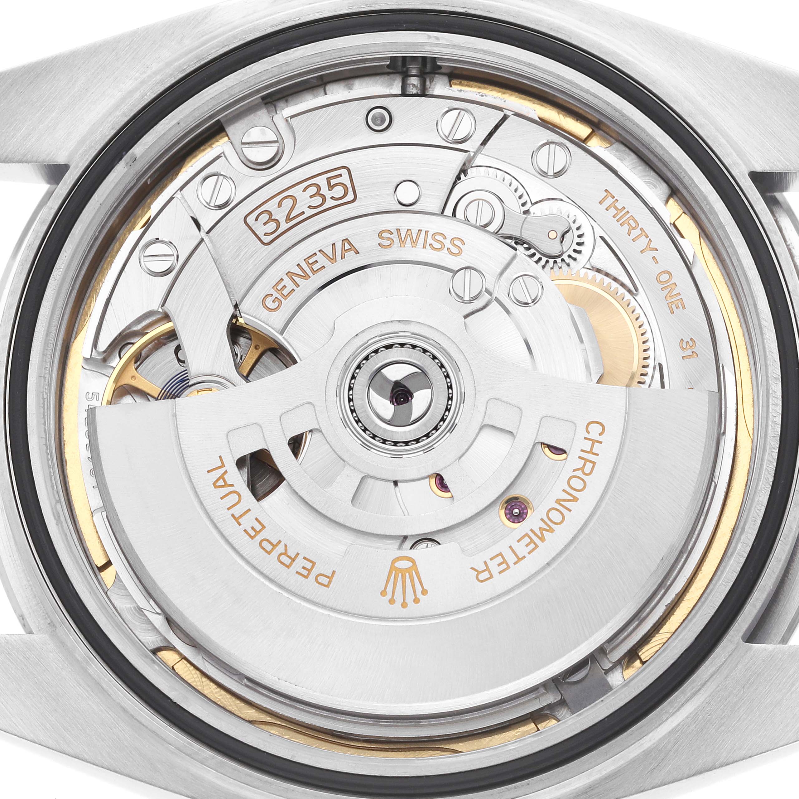 The image shows the rear view of the Rolex Datejust 41 126300 Men
s Stainless Steel Blue Dial, focusing on its intricate movement mechanism.