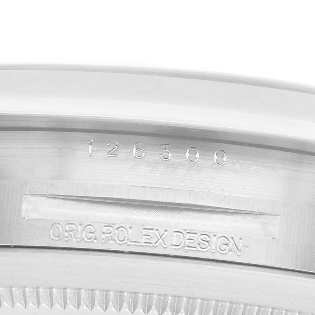 The image shows a close-up of the Rolex Datejust 41 126300 Men
s Stainless Steel Blue Dial
s case edge, highlighting the engraved model and design text.