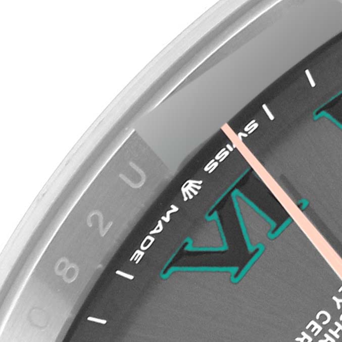 This close-up image shows a portion of the dial and the edge of the bezel of a Rolex Datejust 41 126301 Men's Steel and Gold (two tone) Grey Dial 126301 Men's Steel and Gold (two tone) Grey Dial watch.